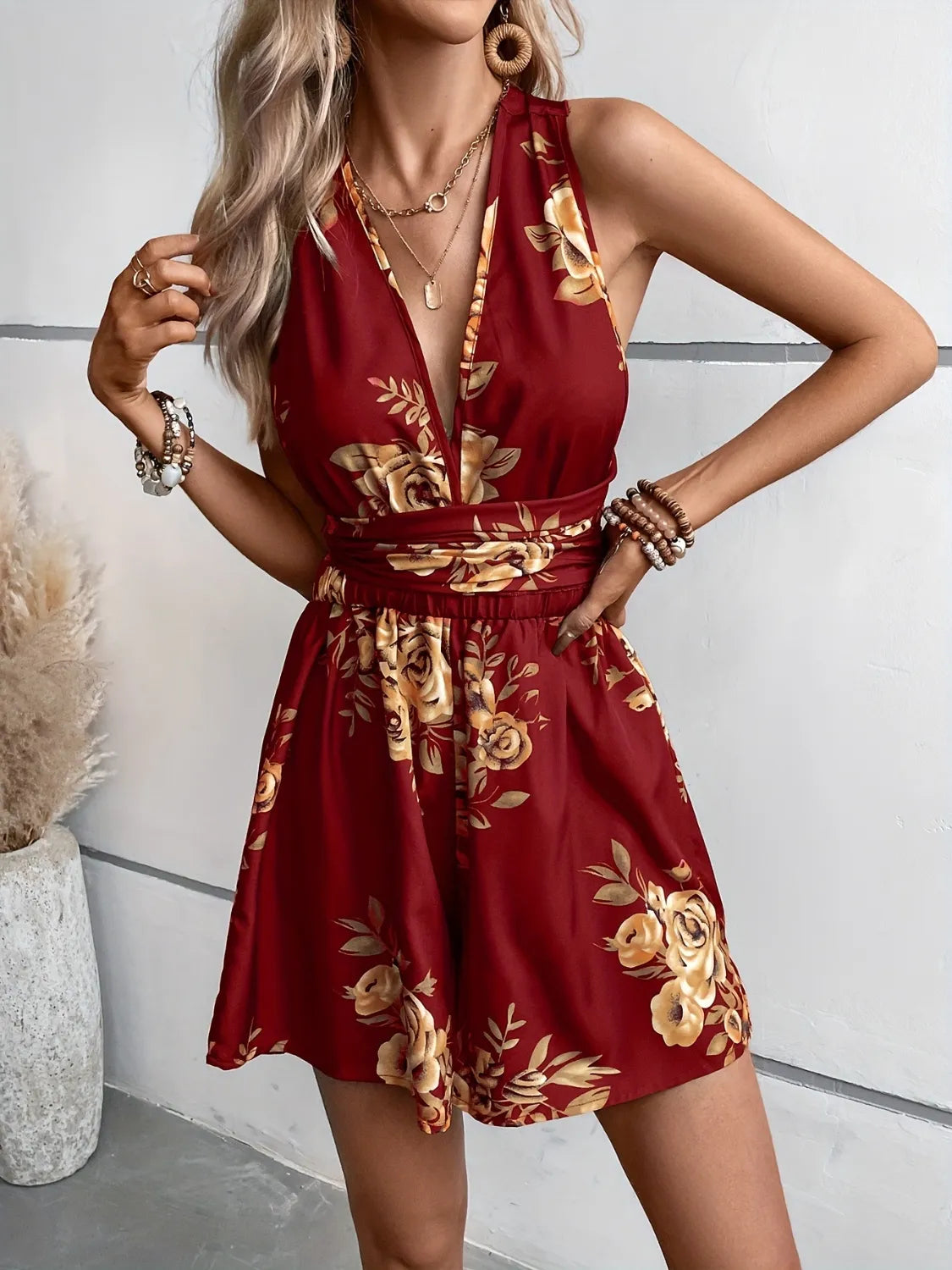 Burgundy floral printed romper with V-neck and gathered tie waist