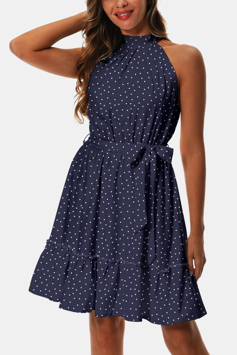 Dark blue printed tie-waist halter dress with white dot pattern and frill tiers