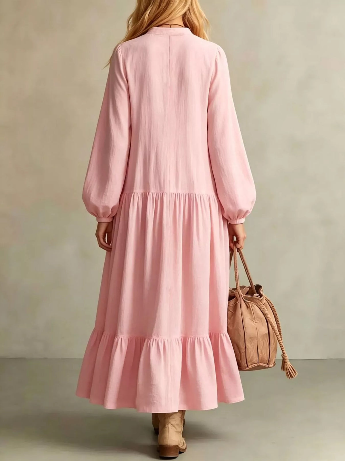 Pink tiered maxi dress with button placket, back view and long puff sleeves