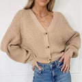 Tan button-front V-neck long sleeve cardigan with ribbed cuffs and knit texture