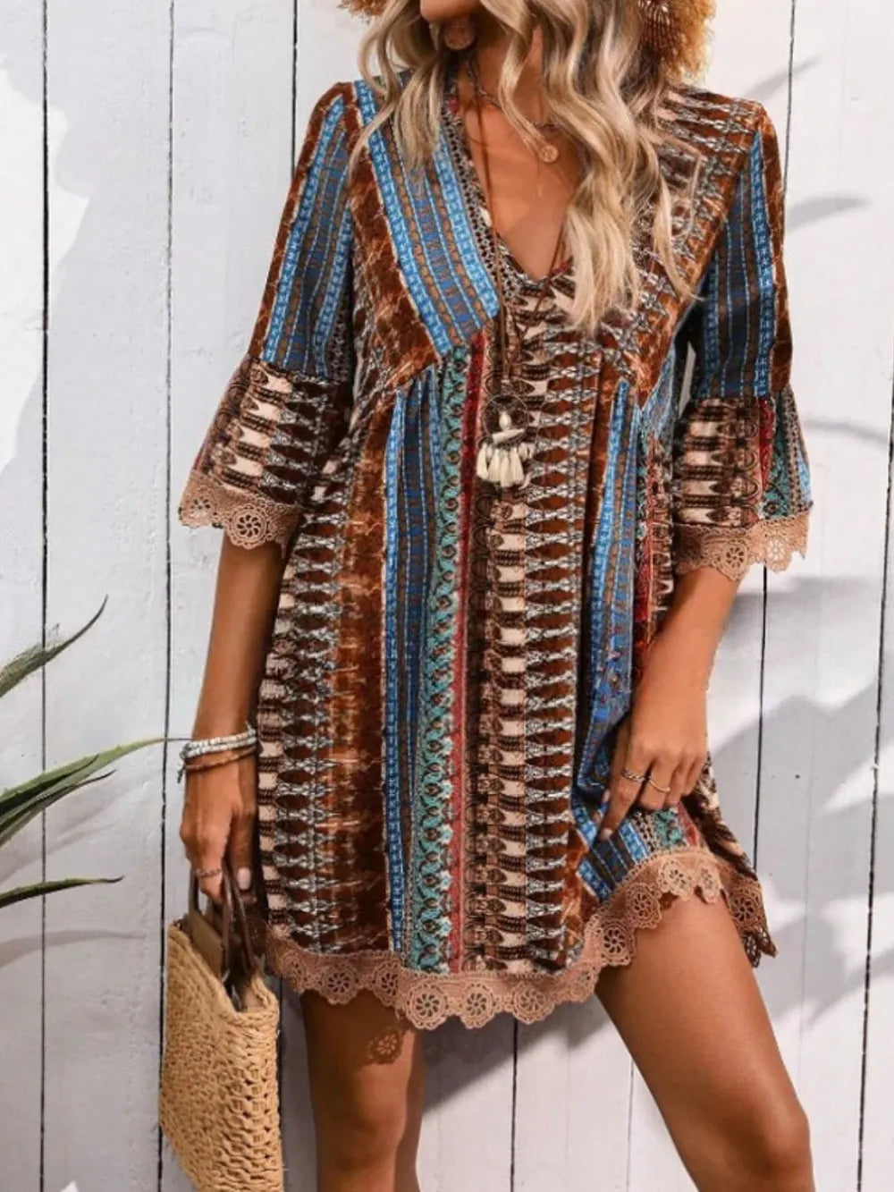 Printed V-neck dress with lace trim, brown and blue striped pattern, 3/4 sleeves