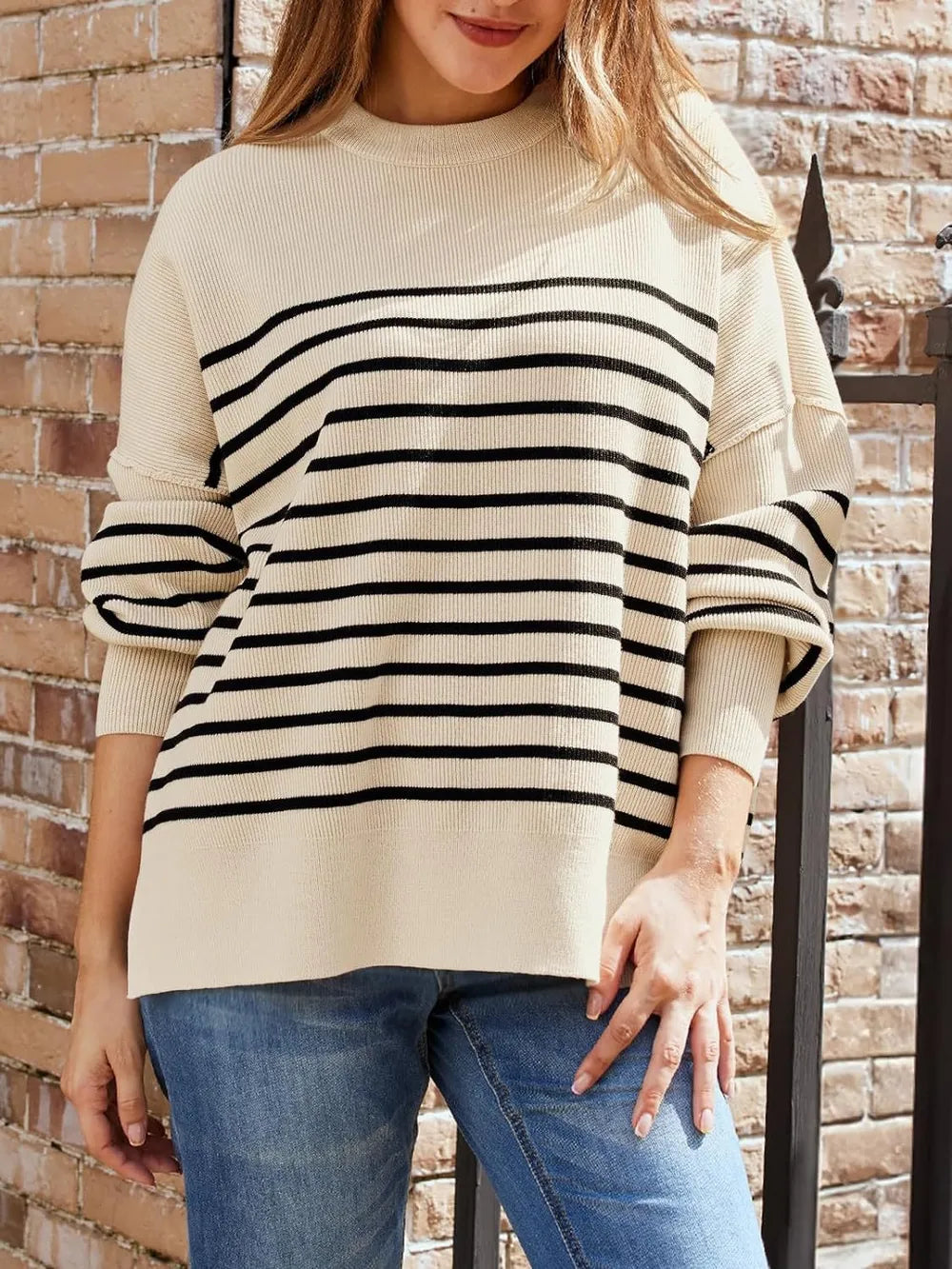 Tan long-sleeve sweatshirt with round neck and black-and-white horizontal stripe front