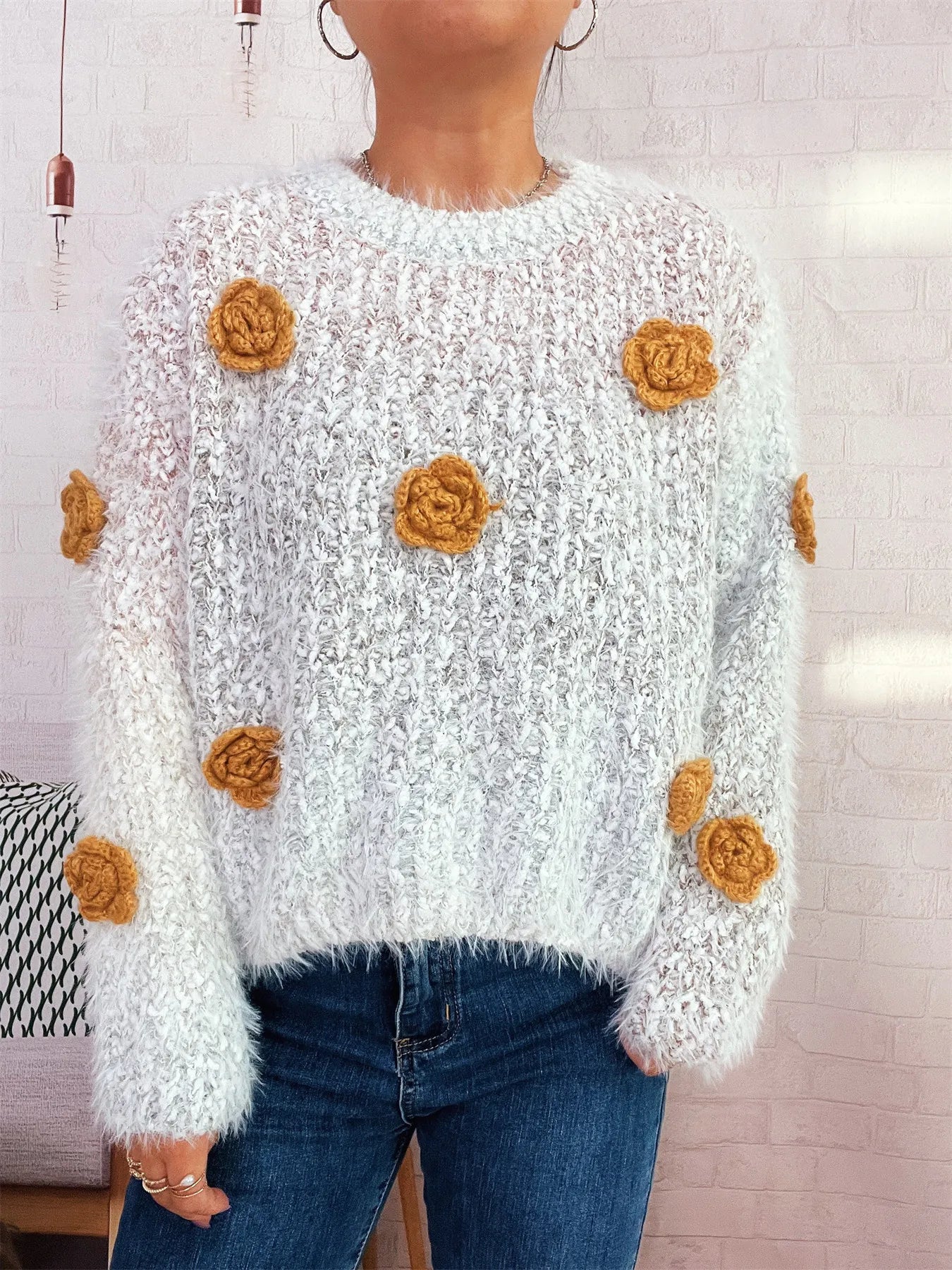 Flower-embellished round-neck sweater, fuzzy white knit with orange rosette embellishments