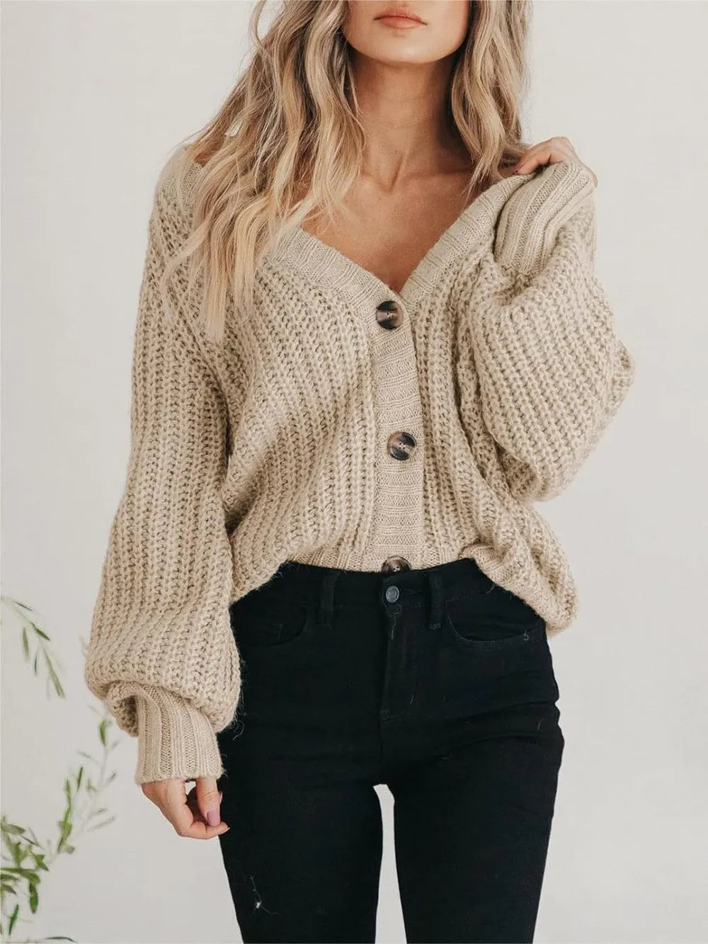 Light tan button-up long-sleeve cardigan with chunky texture, V-neck, and button closure