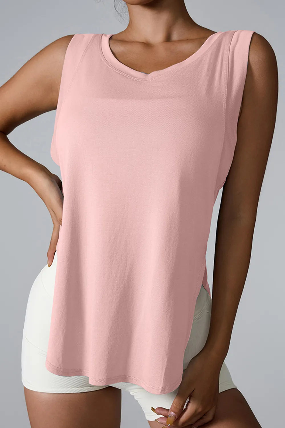 Women’s blush pink active tank with round neck and sleeveless fit