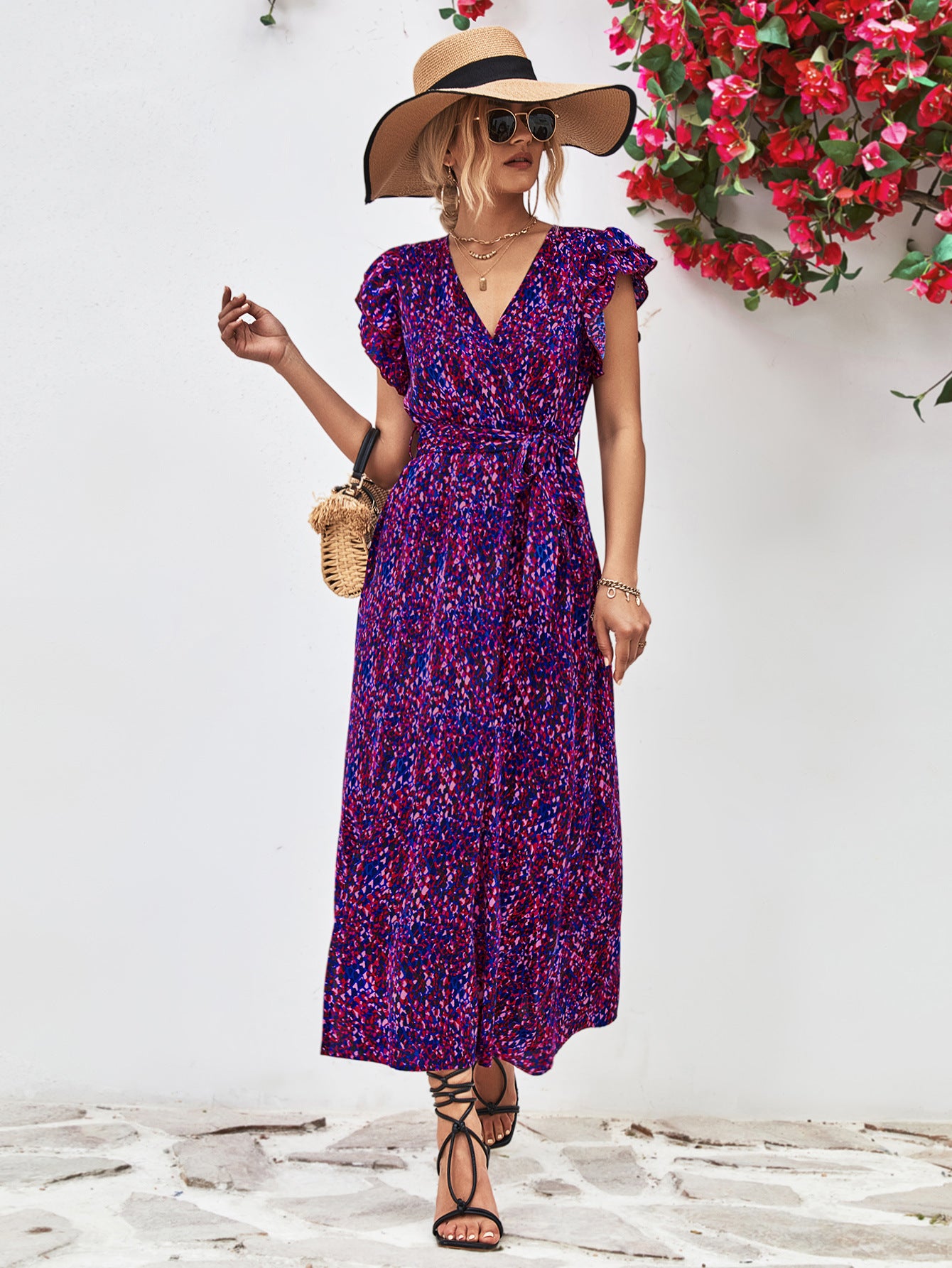 Purple printed surplice neck flutter sleeve slit dress, midi length with V neckline and side slit.