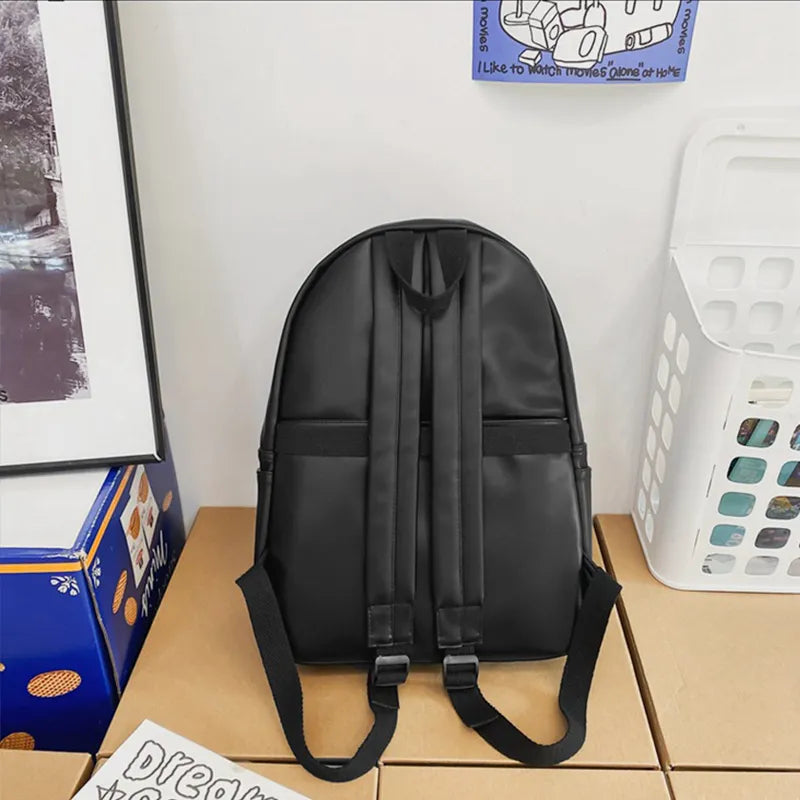 Black vegan leather zip backpack back panel with adjustable shoulder straps