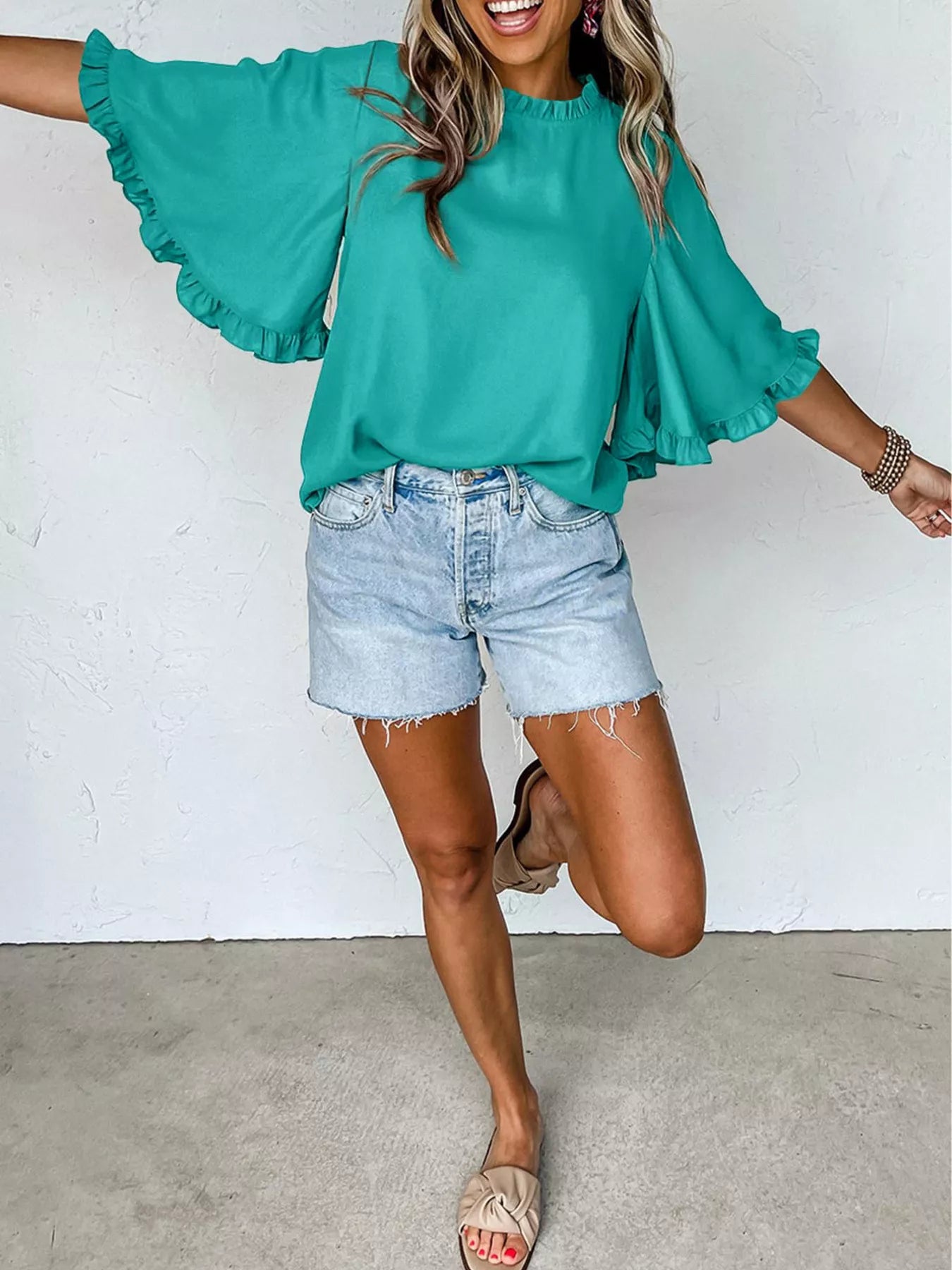 Ruffle Trim Half Sleeve Blouse by Trendsi in teal, paired with denim shorts