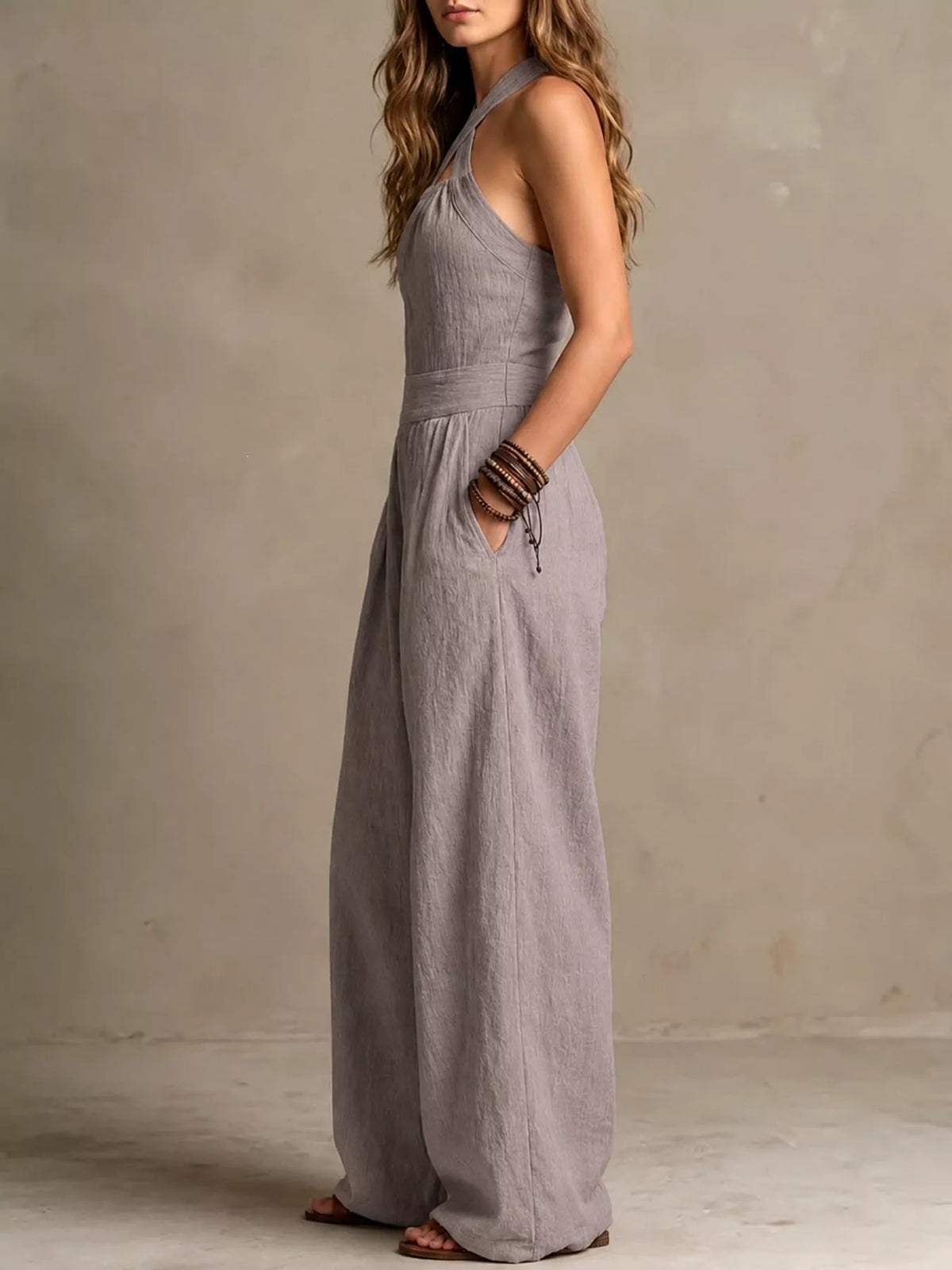 Light gray halter linen jumpsuit with V halter neckline, high waist, wide legs