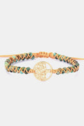Handmade beaded bracelet with braided turquoise and orange cord, gold tree coin centerpiece