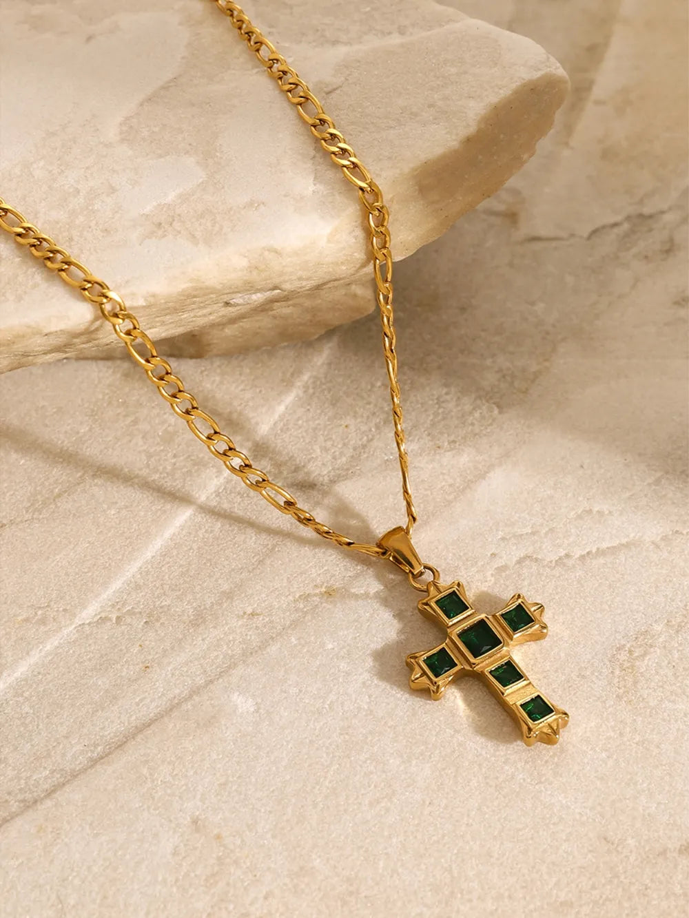 Gold-tone cross pendant necklace with green center and clear square stones
