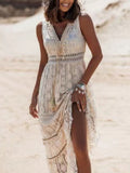 Lace V-neck sleeveless maxi dress in ivory with tassel waist ties by Trendsi