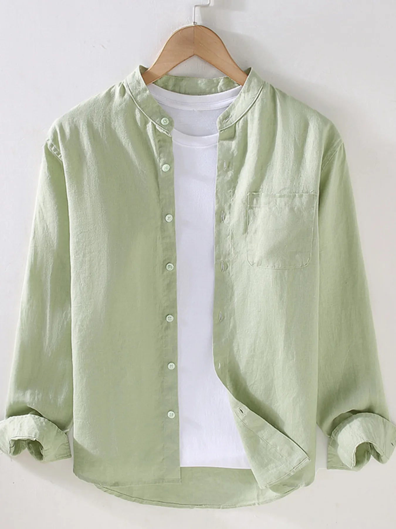 Men's long sleeve button-up shirt in light green with front buttons and chest pocket