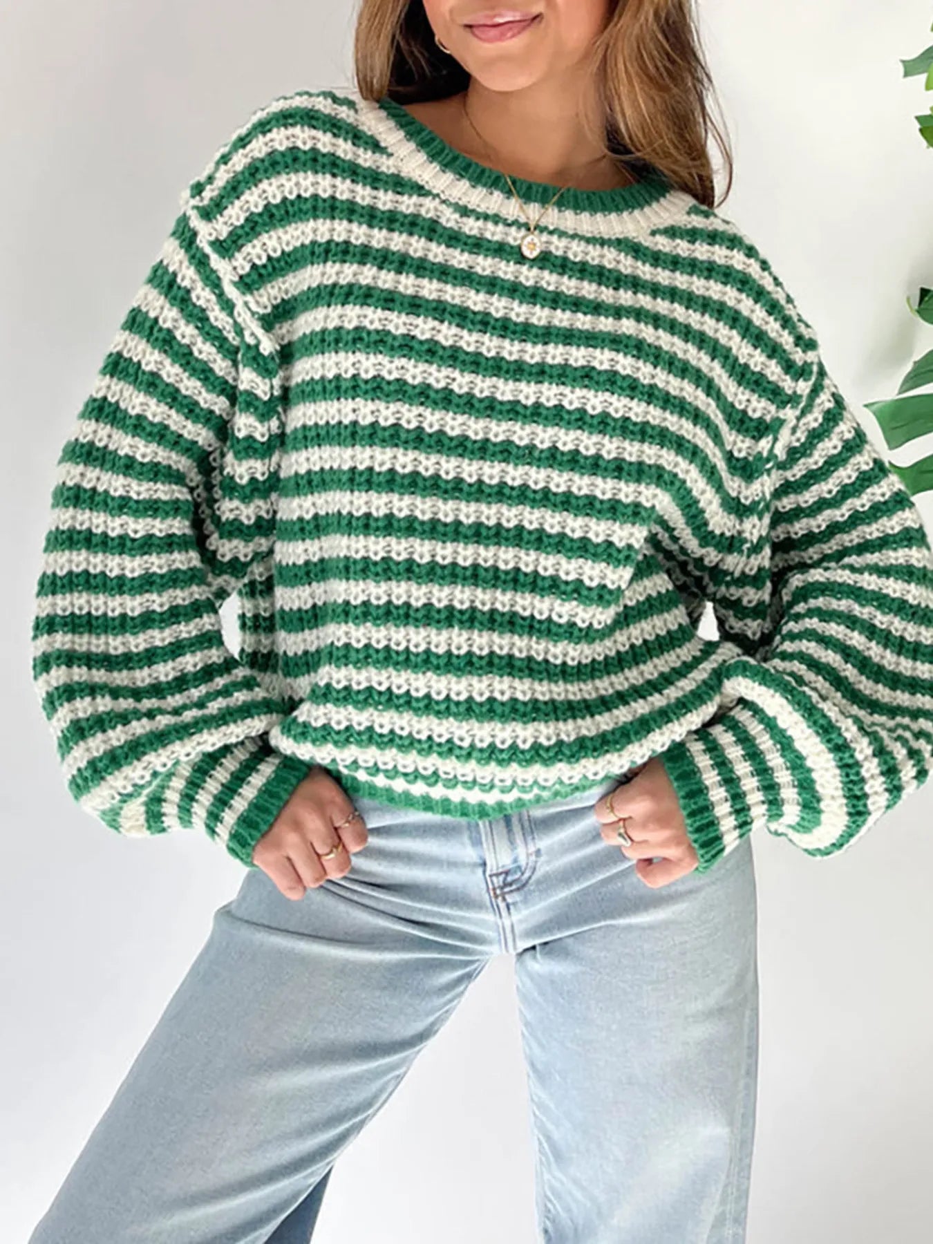 Green-and-white striped oversized drop-shoulder sweater, wide knit sleeves