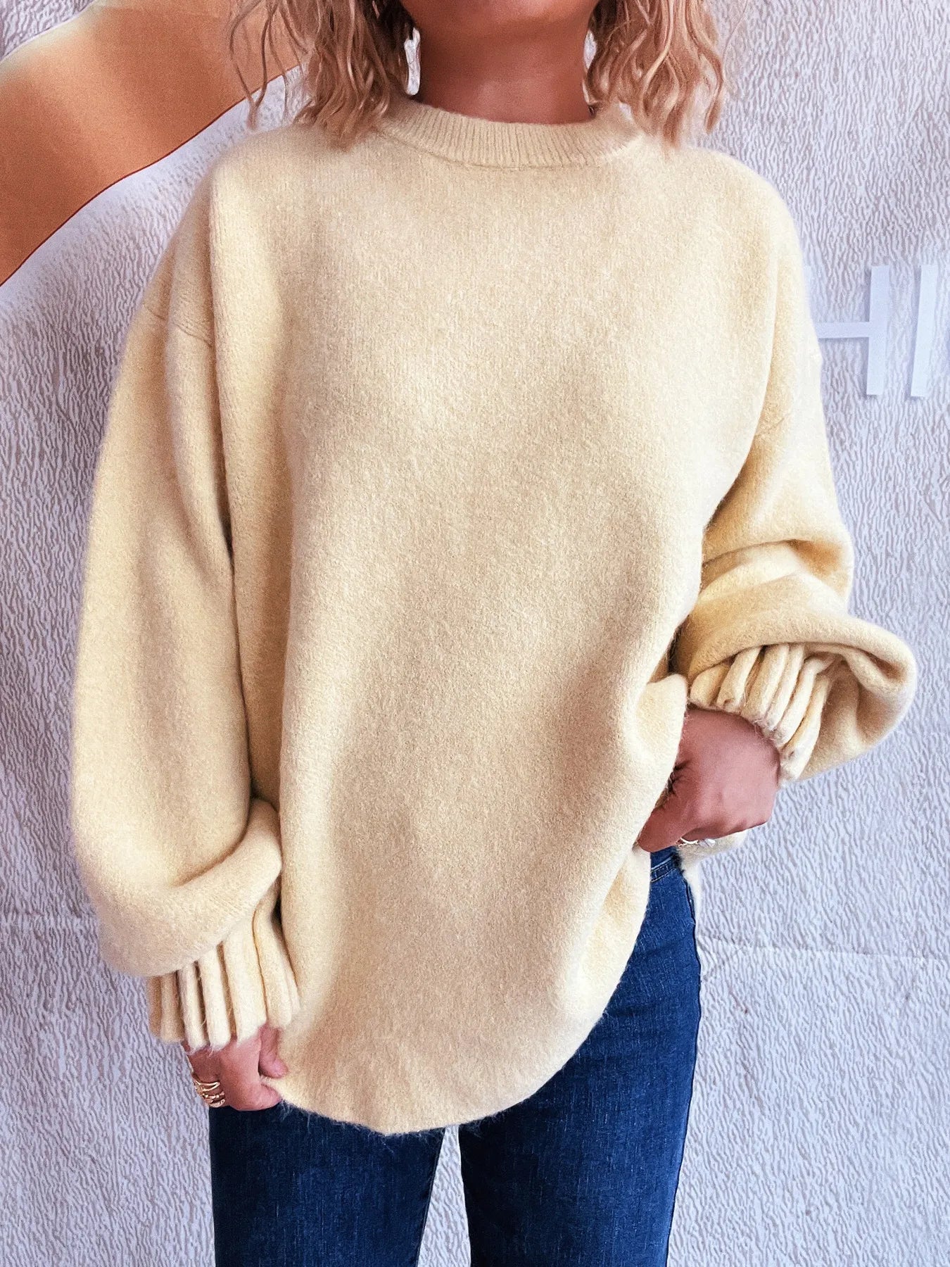 Cream round neck dropped-shoulder sweater with ribbed cuffs and hem