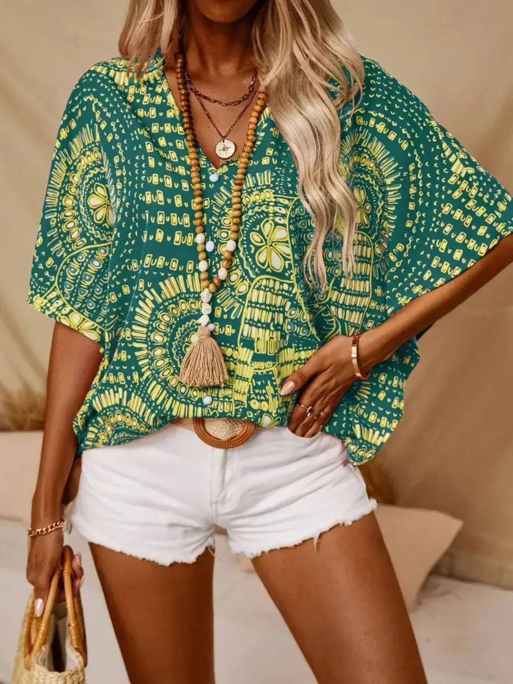 Green printed V-neck half-sleeve top with gold circular mandala motifs