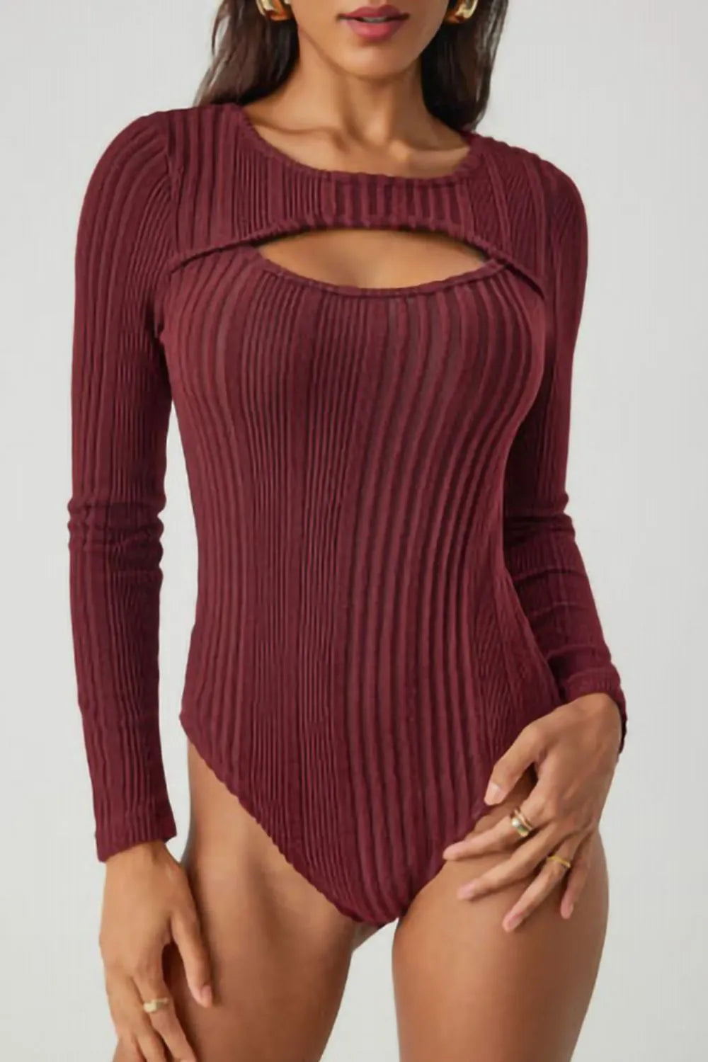 Deep red ribbed knit bodysuit with long sleeves, round neck and chest cutout