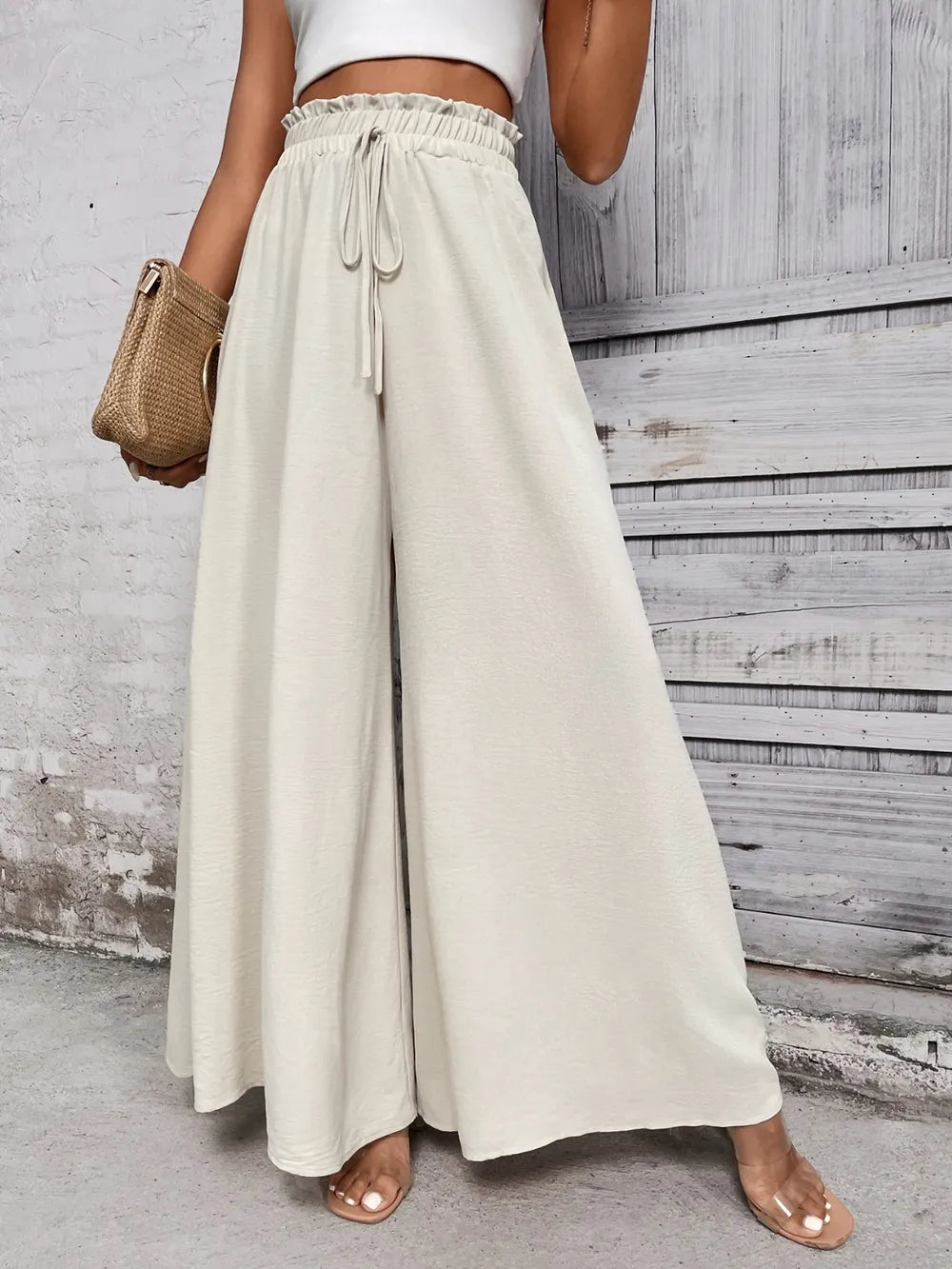 Light beige high waist wide-leg pants with elastic waistband and drawstring ties