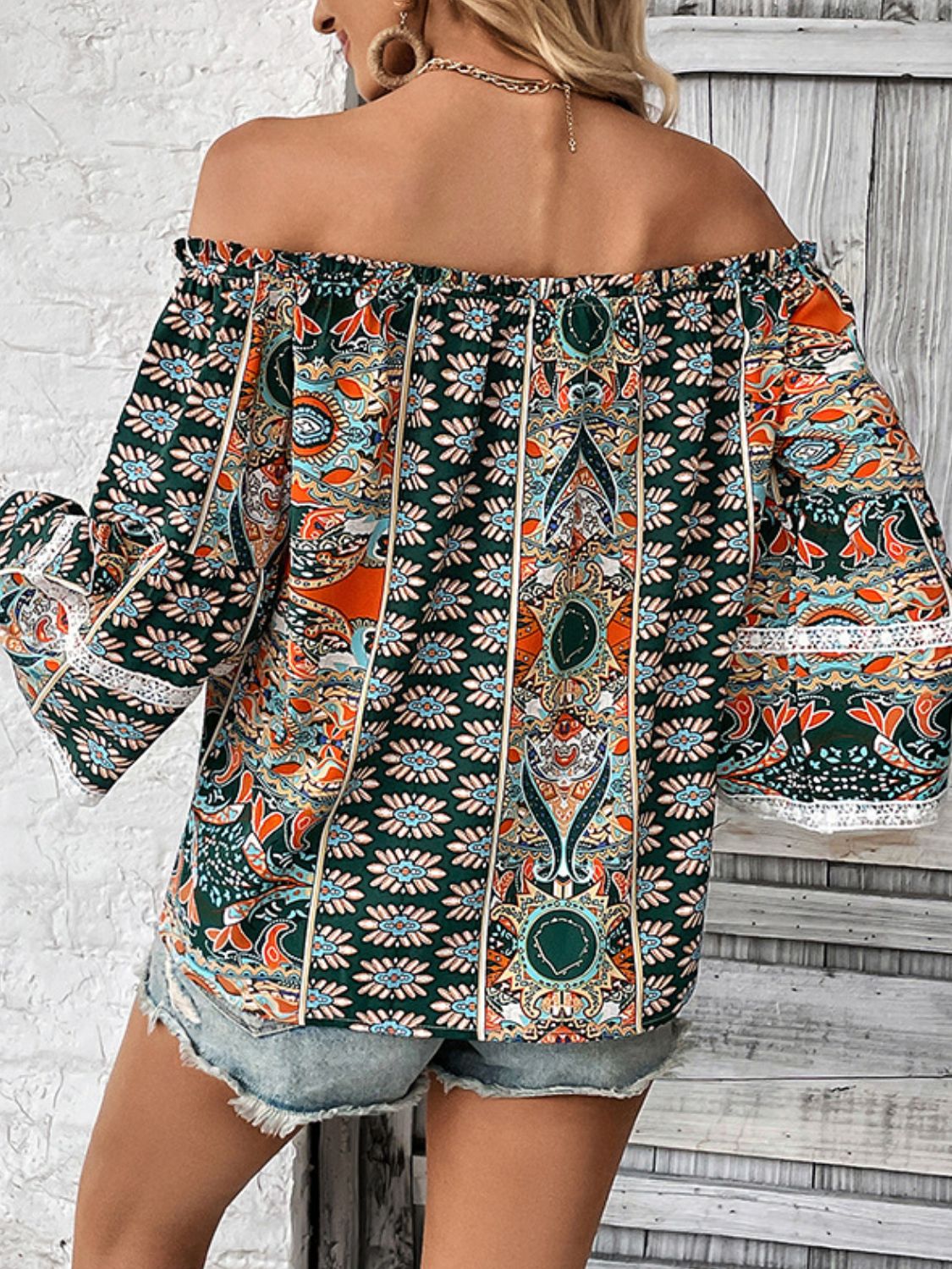 Multicolor printed off-shoulder blouse with long loose sleeves and gathered elastic neckline