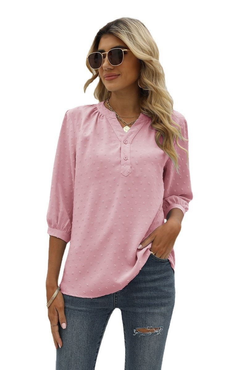 Blush pink Swiss-dot notched-neck blouse with 3/4 puff sleeves and button placket