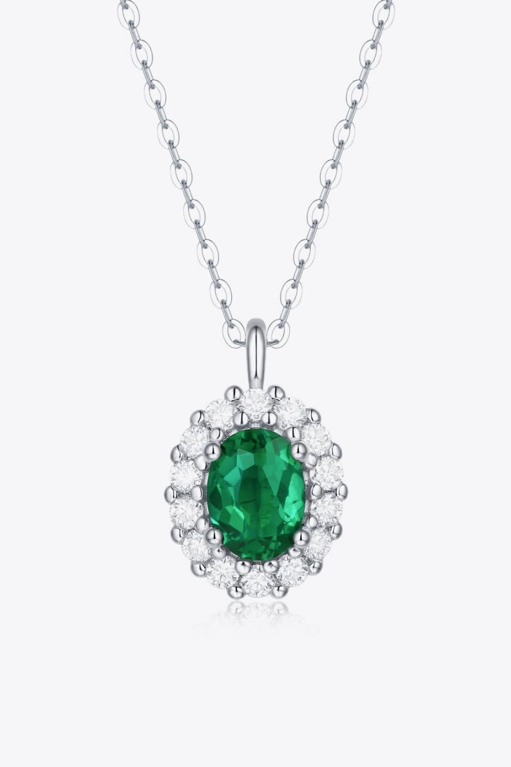 Sterling silver necklace with green emerald halo pendant on linked chain