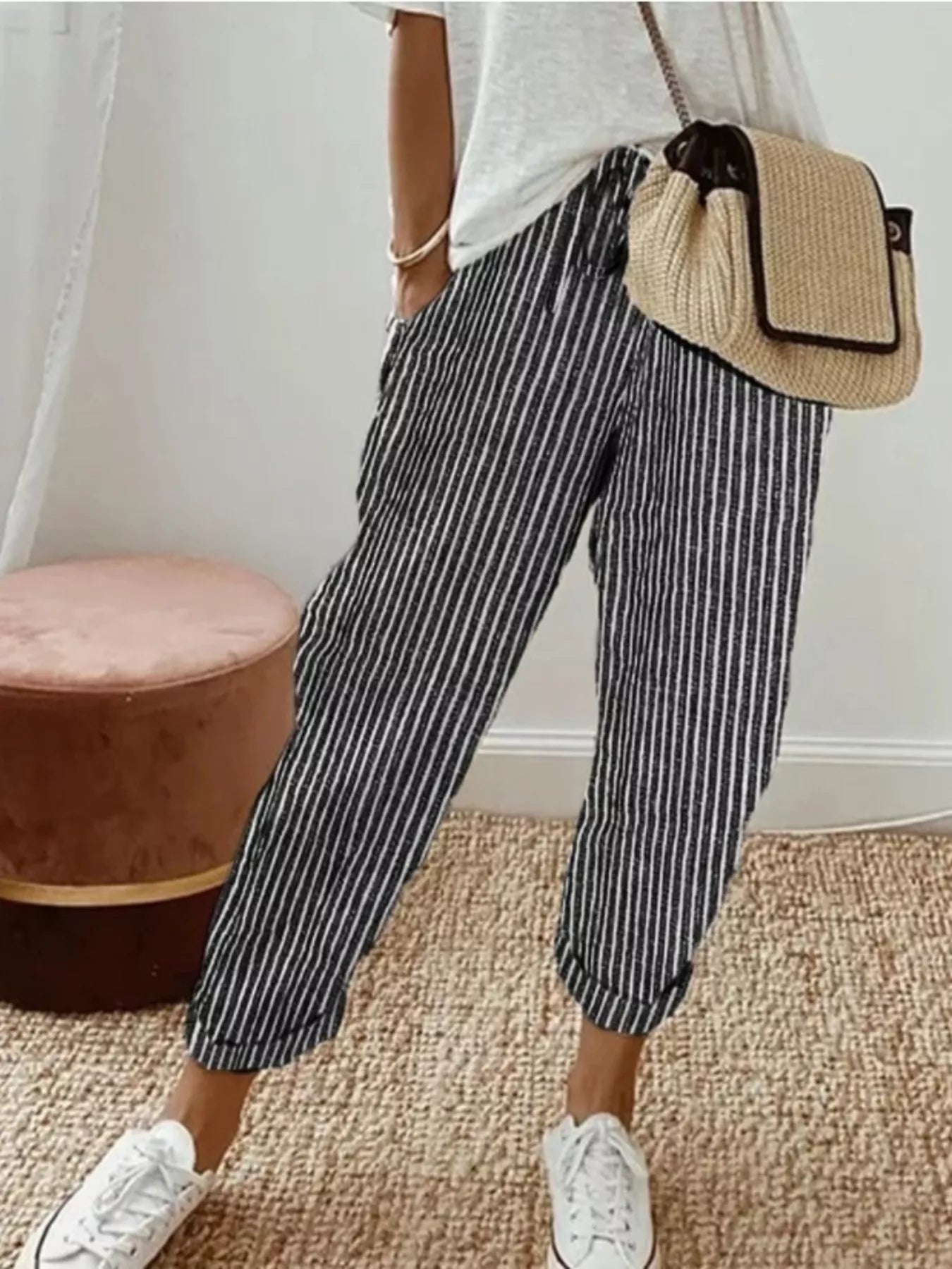 Striped cropped pants with drawstring pockets, black and white vertical stripes