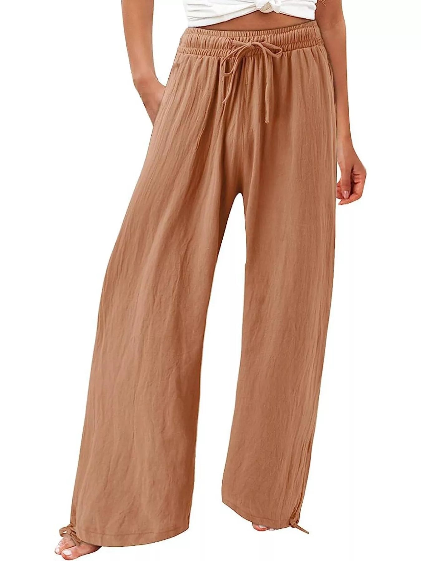 Tan wide-leg pants with drawstring waist and relaxed, flowing wide legs