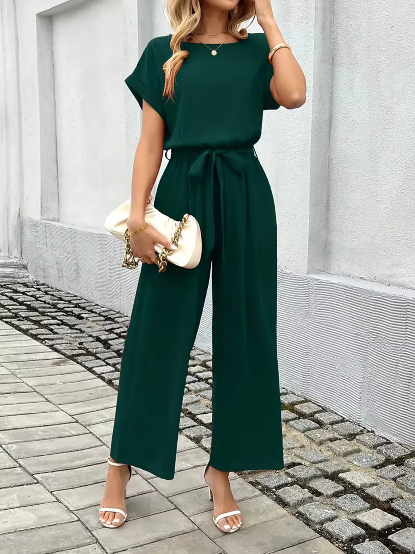 Deep green tie-waist wide-leg jumpsuit with gathered waist tie and wide legs