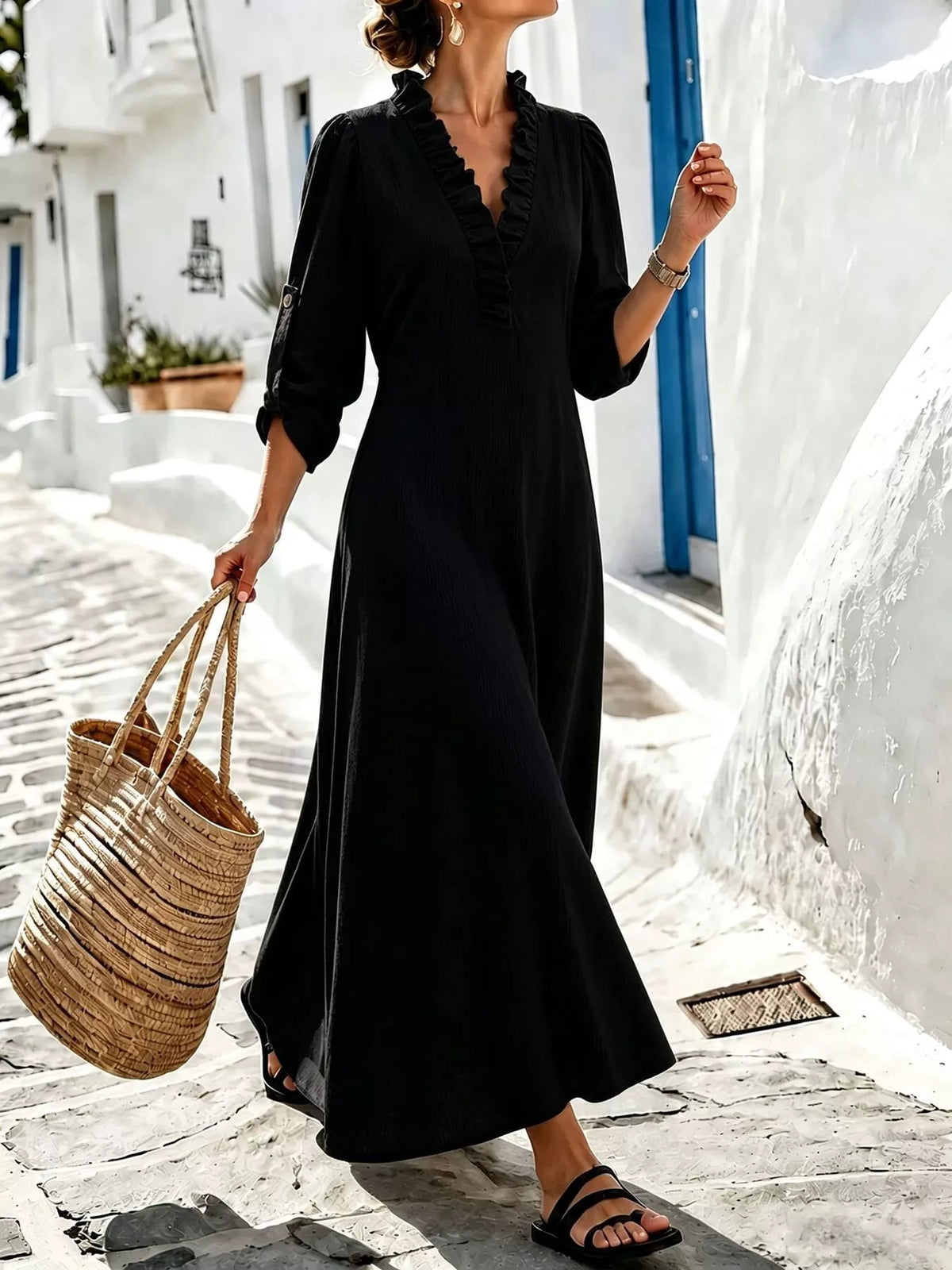 Black long-sleeve maxi dress with ruffled V-neck and relaxed A-line skirt