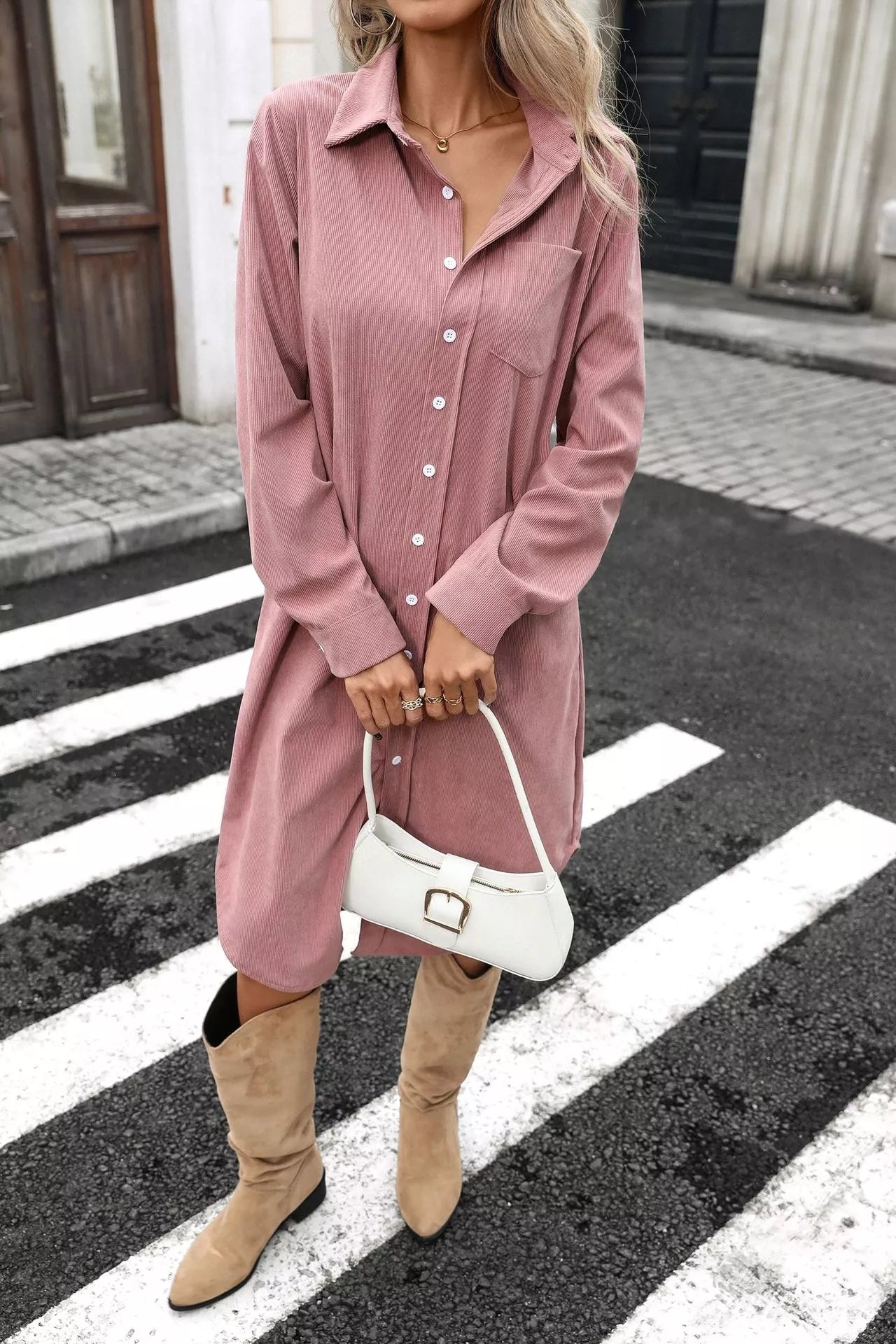 Dusty pink corduroy shirt dress with front button placket, long sleeves, and slit hem