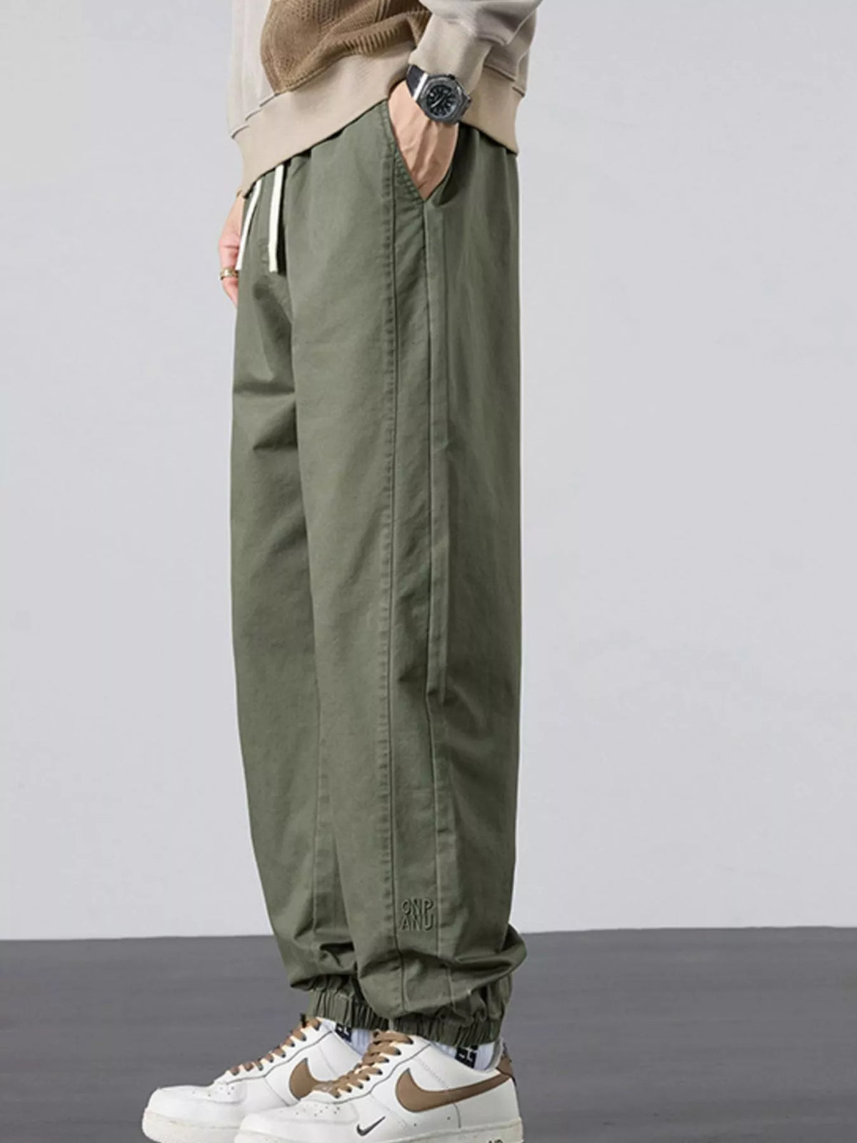 Men's casual army green joggers with elastic waistband and side pockets