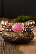 Beaded wrap bracelet with oval pink stone center and multicolor crystal beads