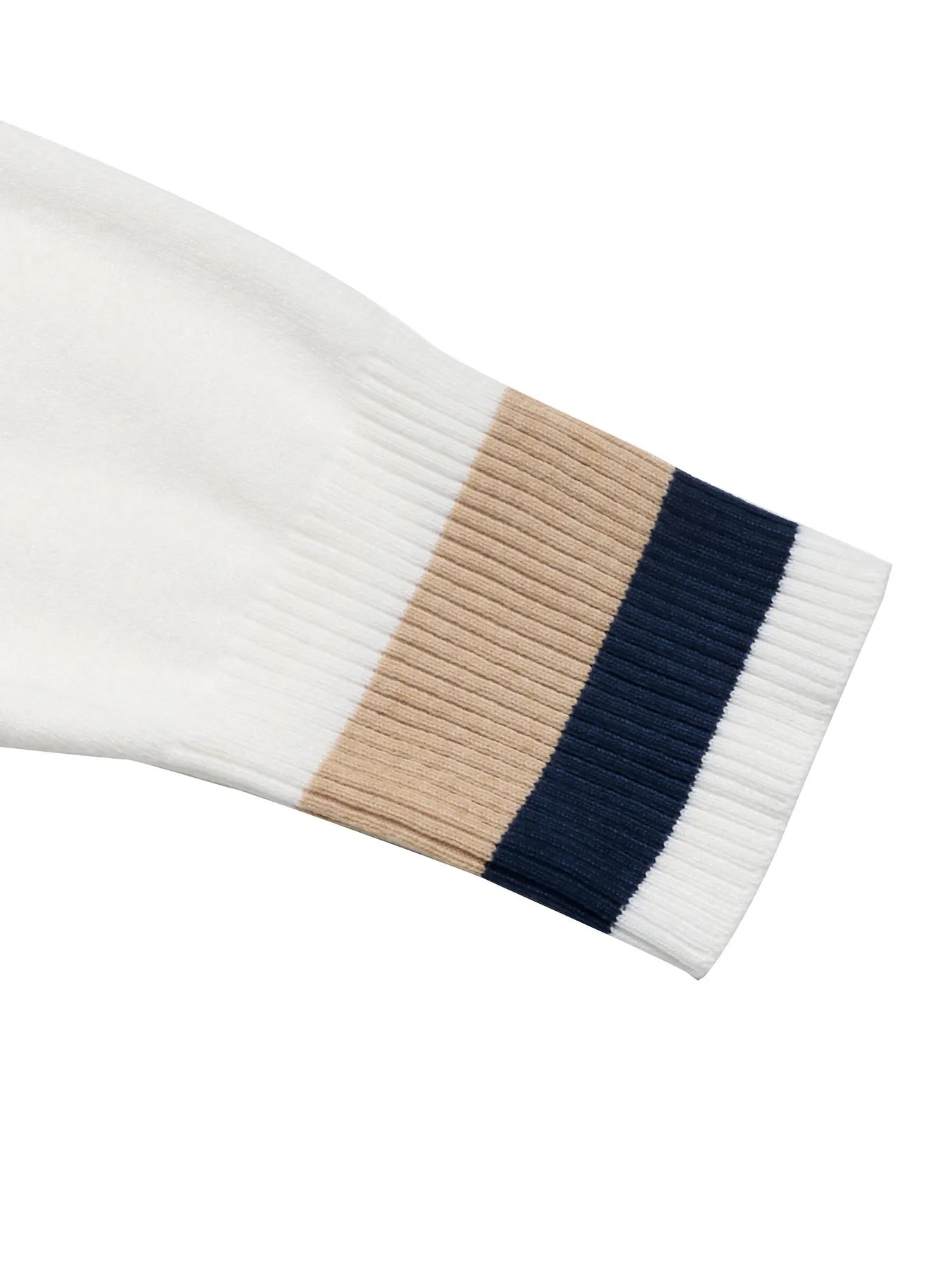 Ribbed sleeve cuff on a color block sweater; white knit with beige and navy stripe