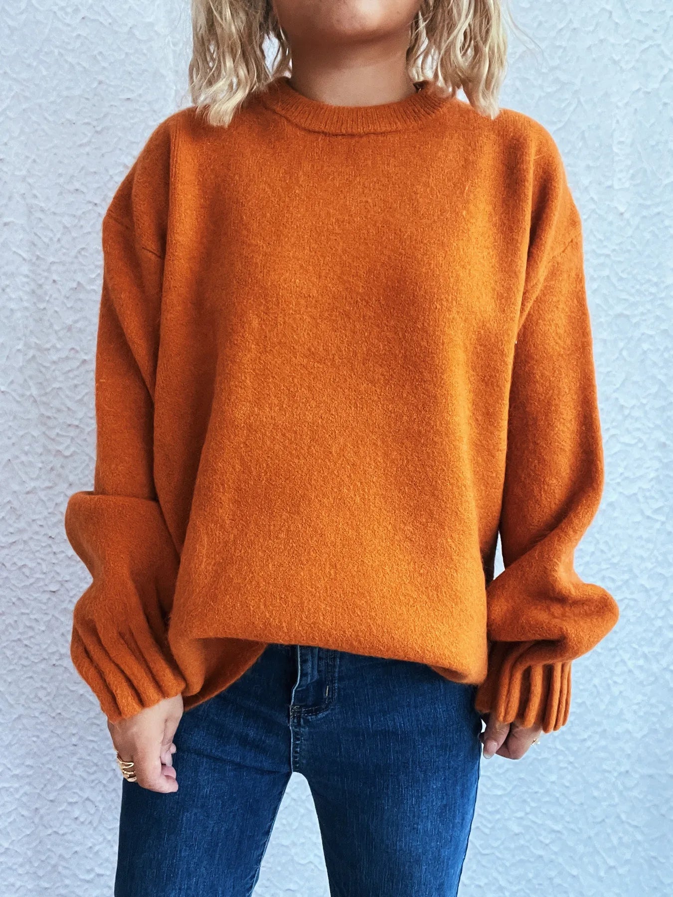 Orange round neck dropped shoulder sweater with ribbed cuffs and hem