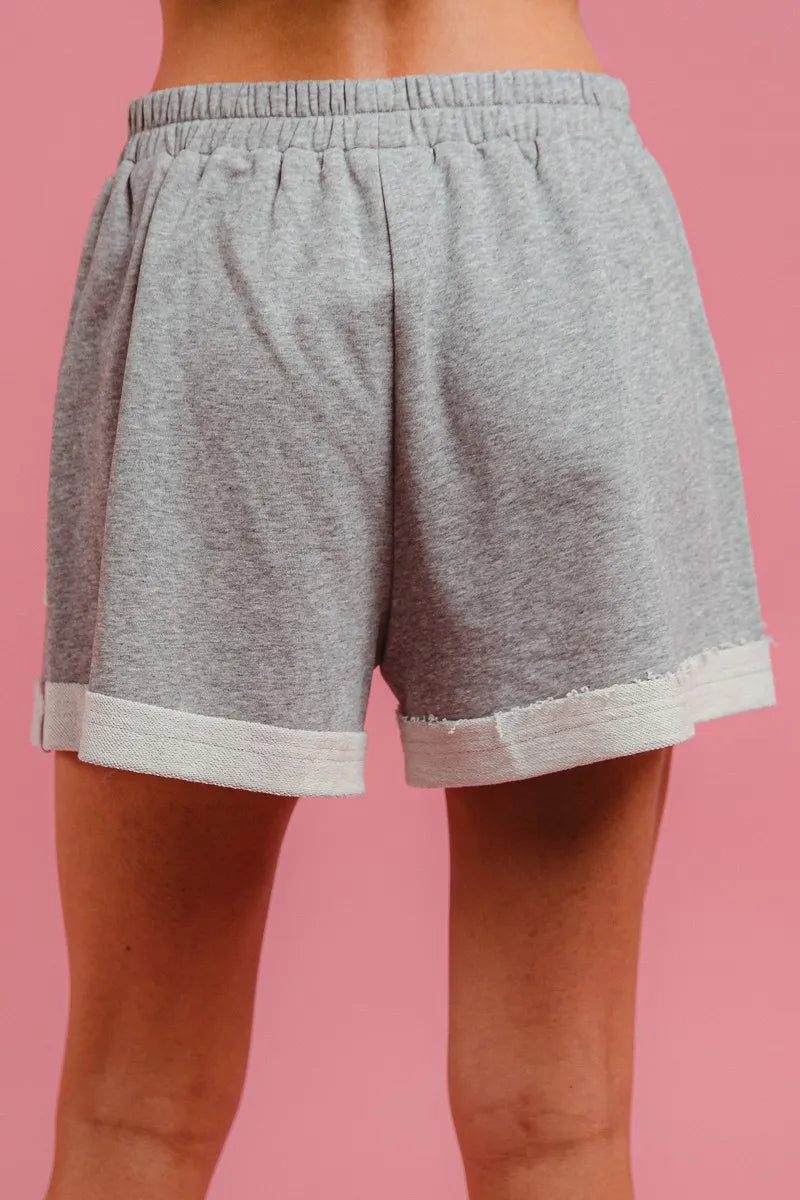 Heather grey French terry knit shorts with elastic waistband and drawstring tie