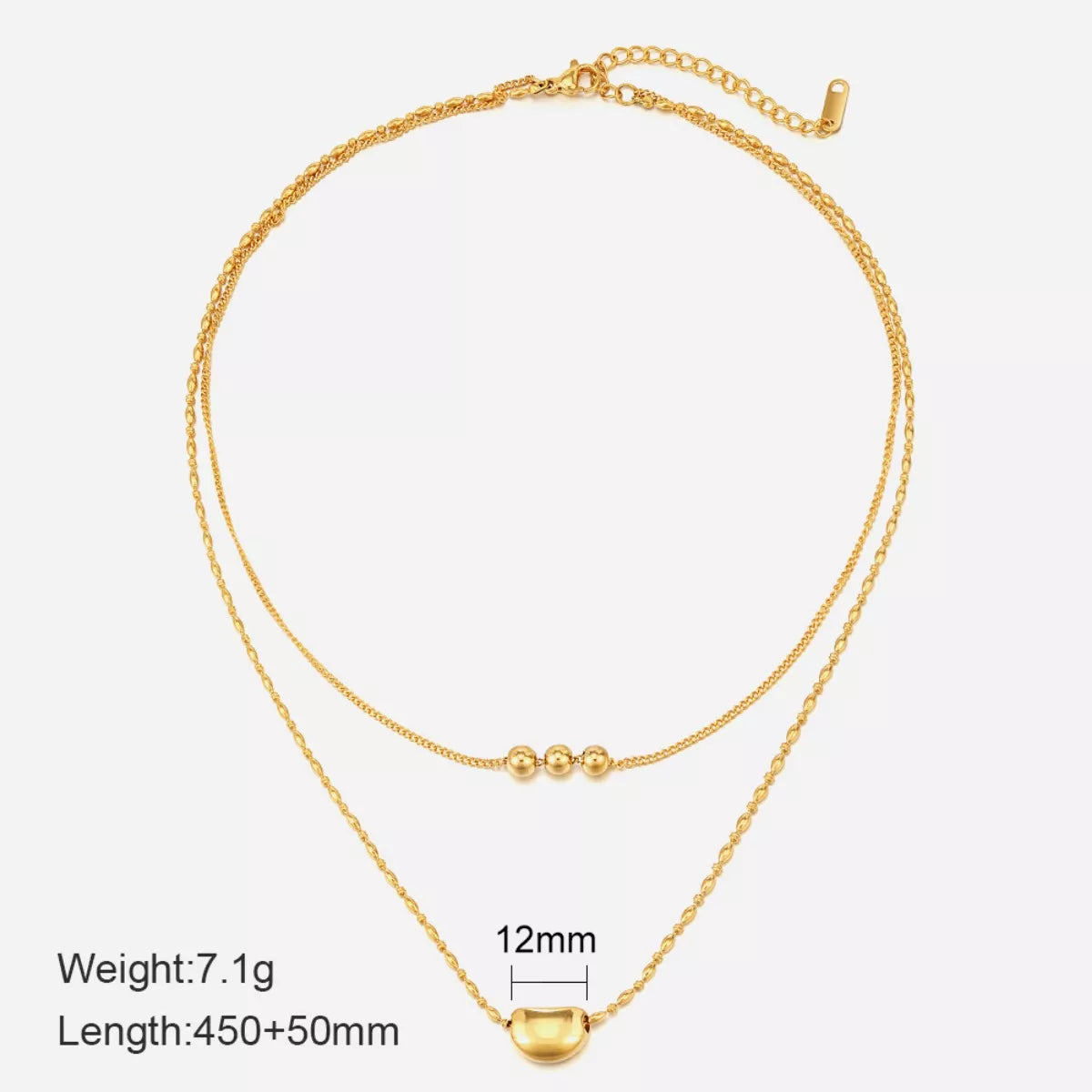 Gold double-layer necklace with heart pendant, triple-bead center, and spring-ring clasp.