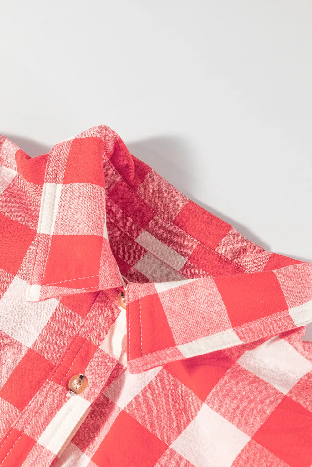 Strawberry plaid shirt dress neckline detail with buttons and collar
