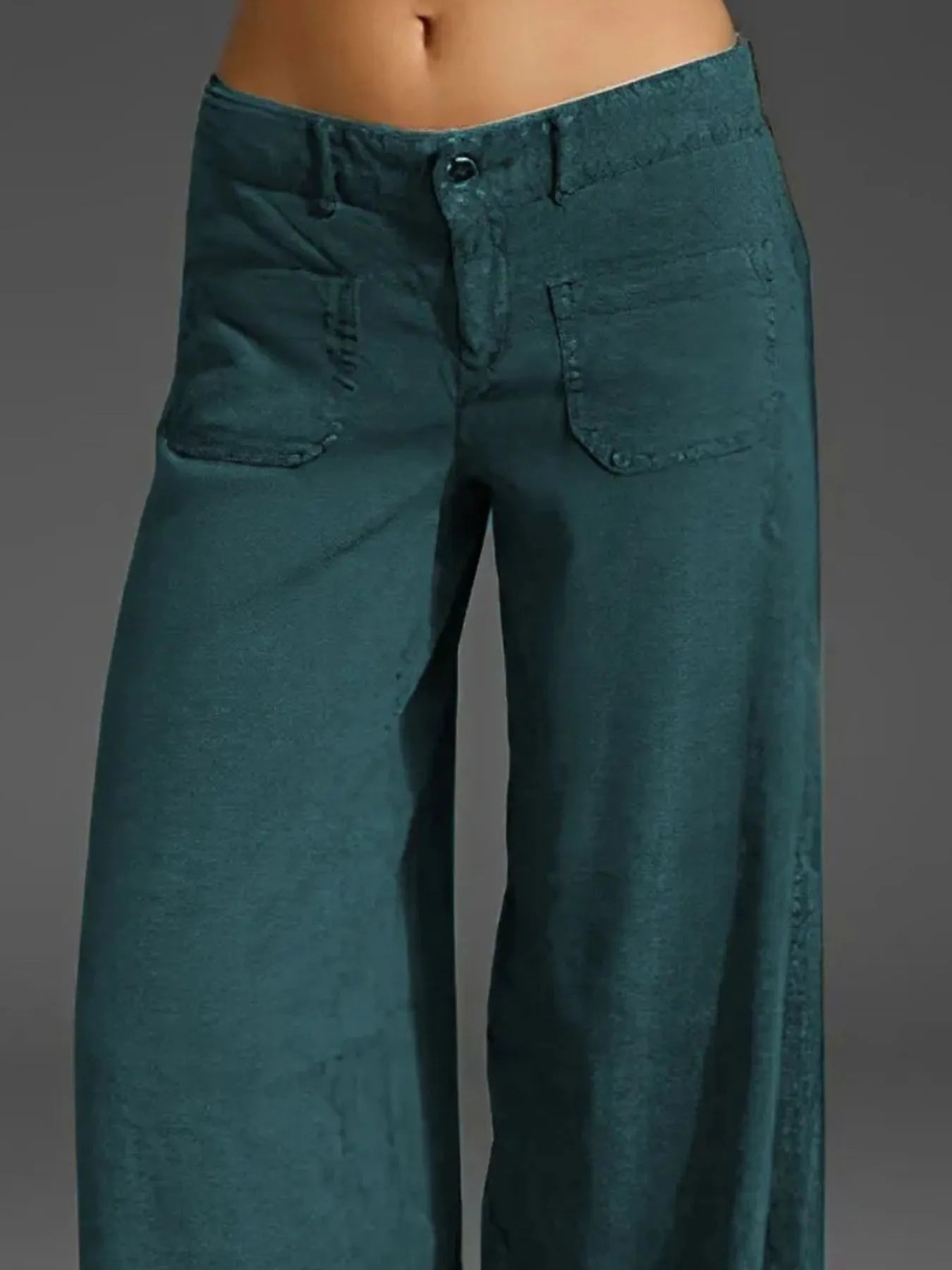 Deep teal wide-leg pants with pockets and button-front closure