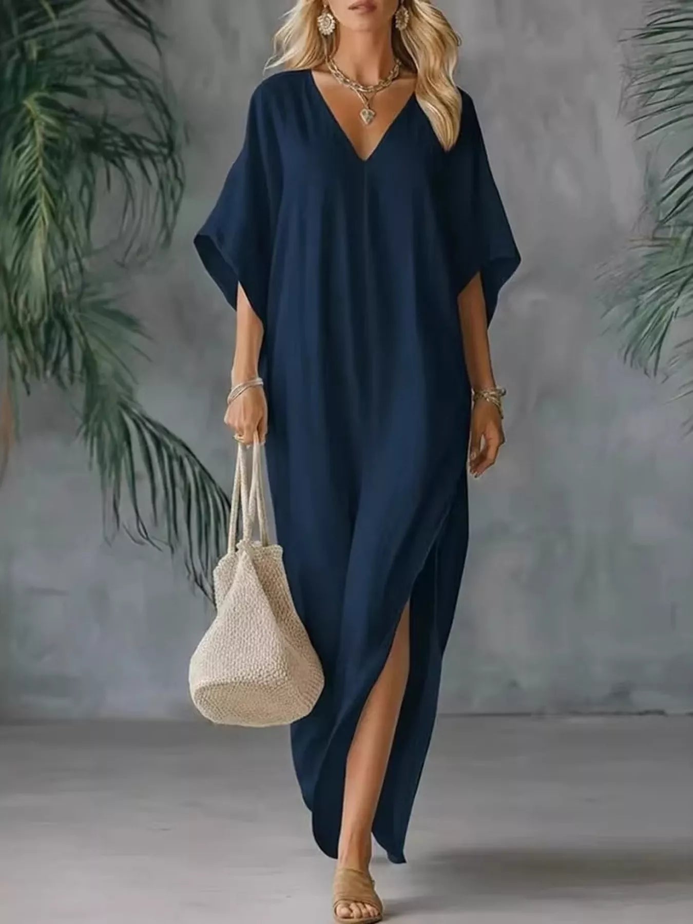 Navy V-neck maxi dress with short sleeves and side slits, loose draped silhouette