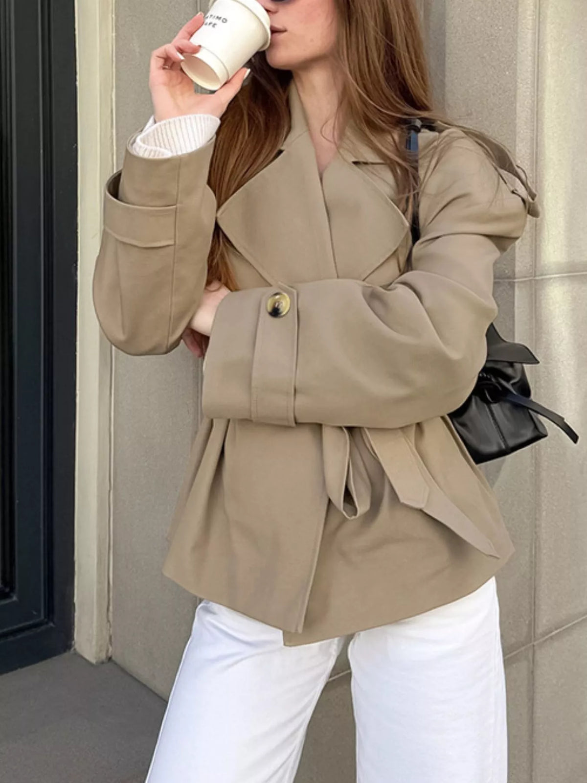Khaki belted trench coat with double-breasted front and gold button detail