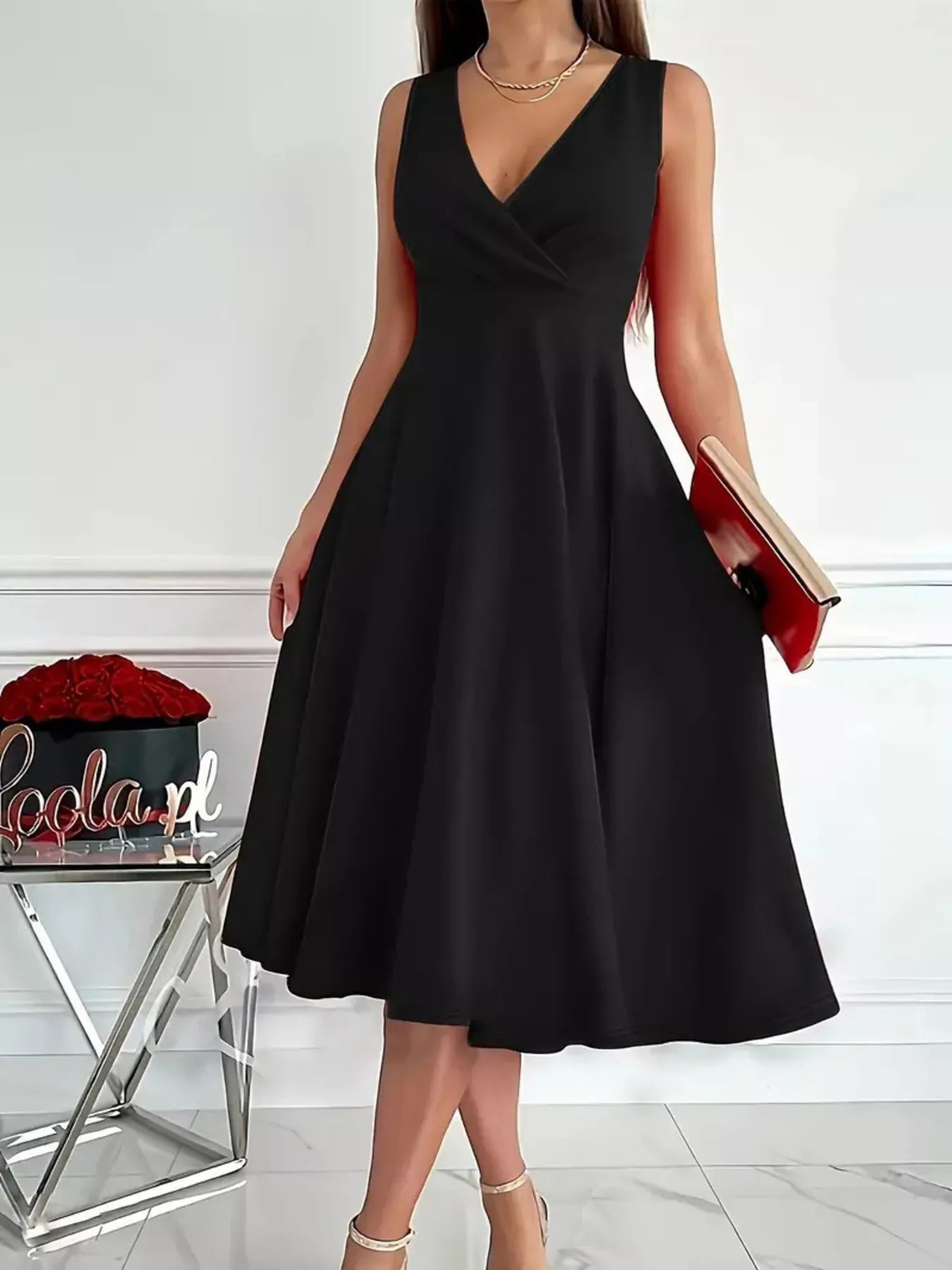 Black sleeveless A-line midi dress with V-neck and flared skirt