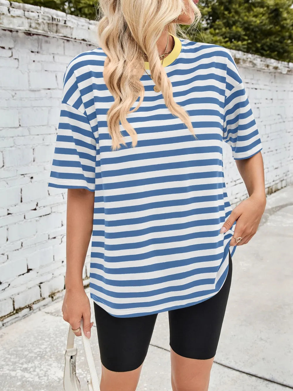 Blue striped round-neck half-sleeve T-shirt with loose sleeves, back view.