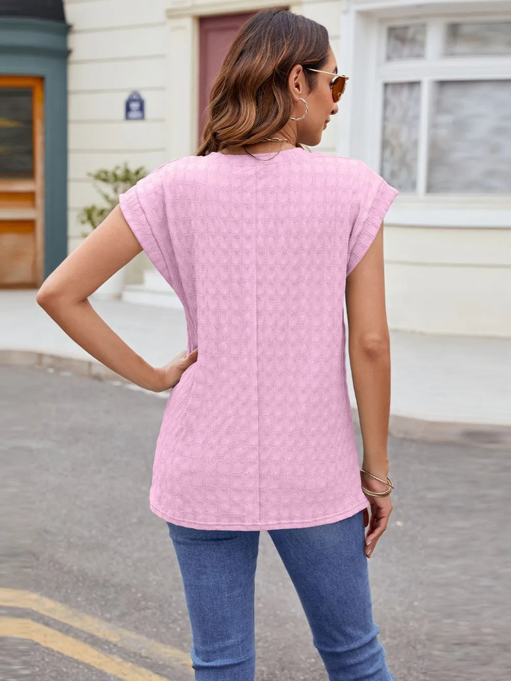 Pink textured round-neck cap-sleeve T-shirt, back view