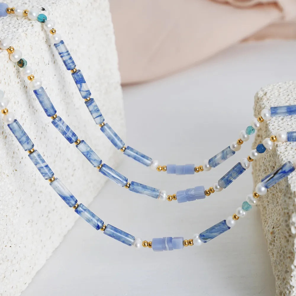 Blue rectangular bead necklace with freshwater pearls and gold spacer beads