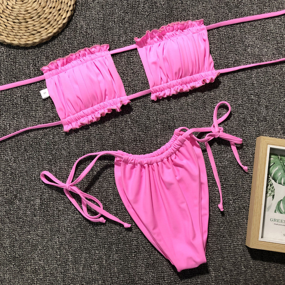 Bright pink ruched bikini set with frill trim: bandeau top and tie bikini bottoms