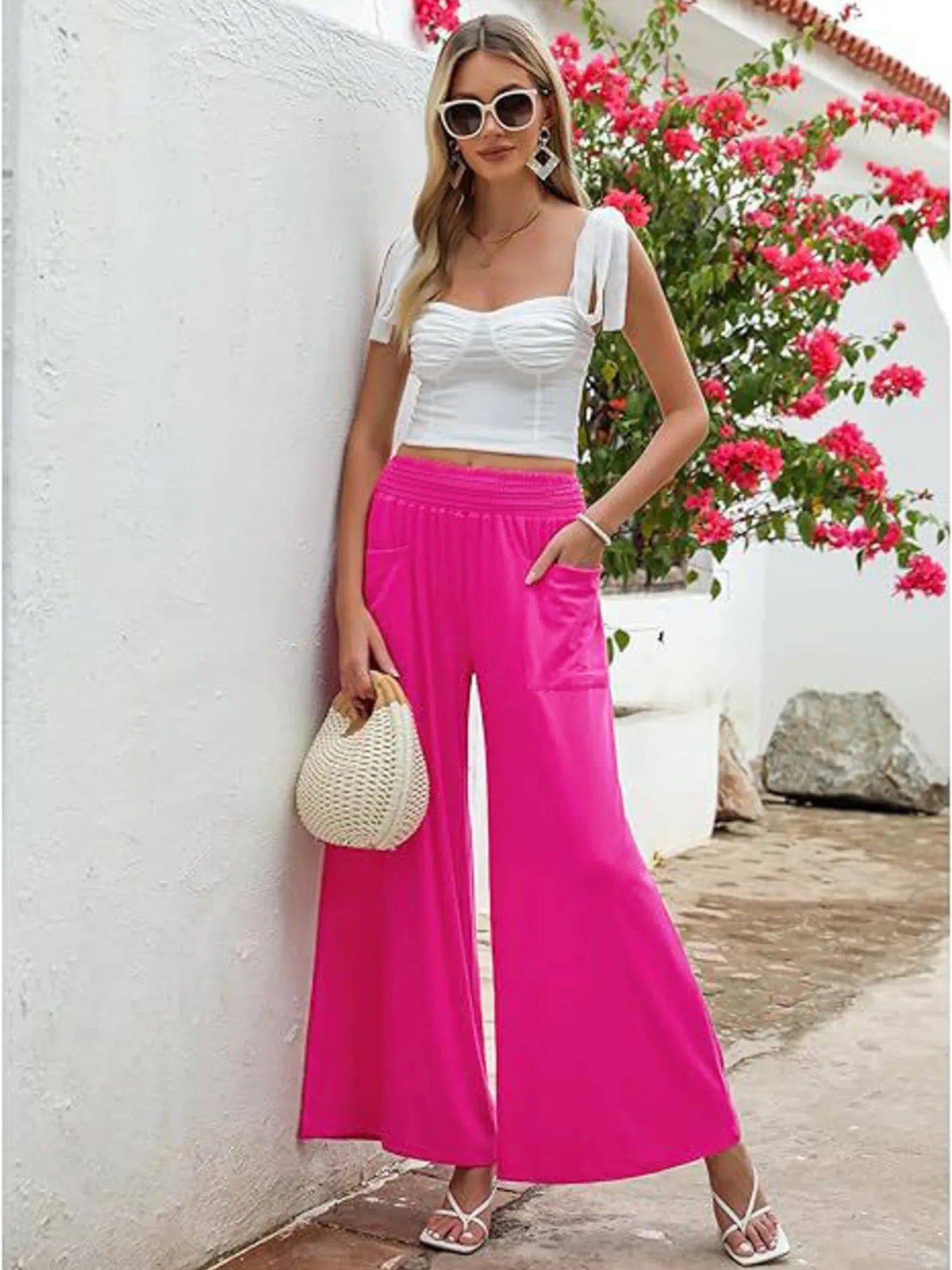 Hot pink high-waisted wide-leg pants with side pockets and elastic waistband