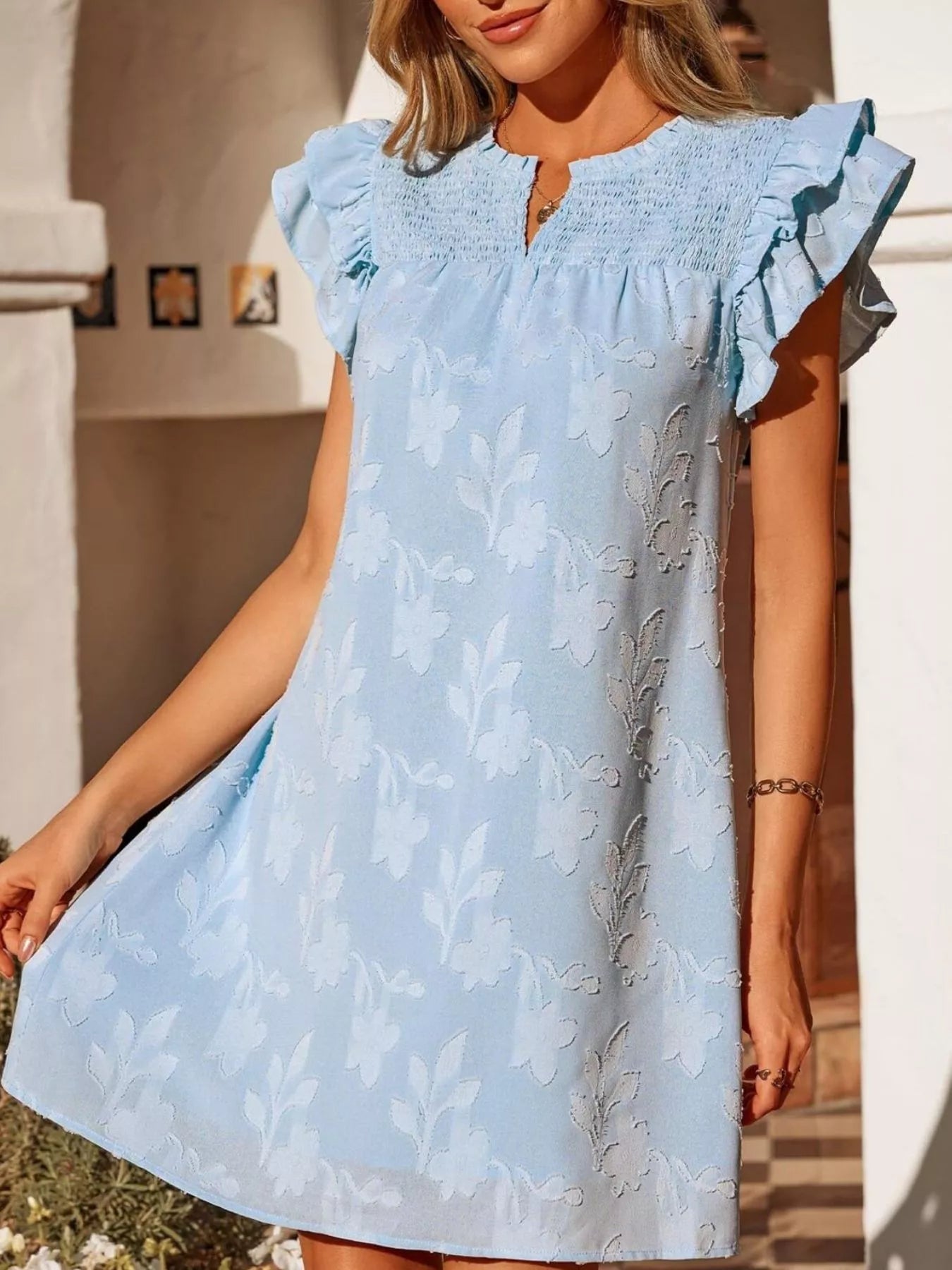 Floral embossed ruffle-sleeve mini dress in light blue with smocked bodice.
