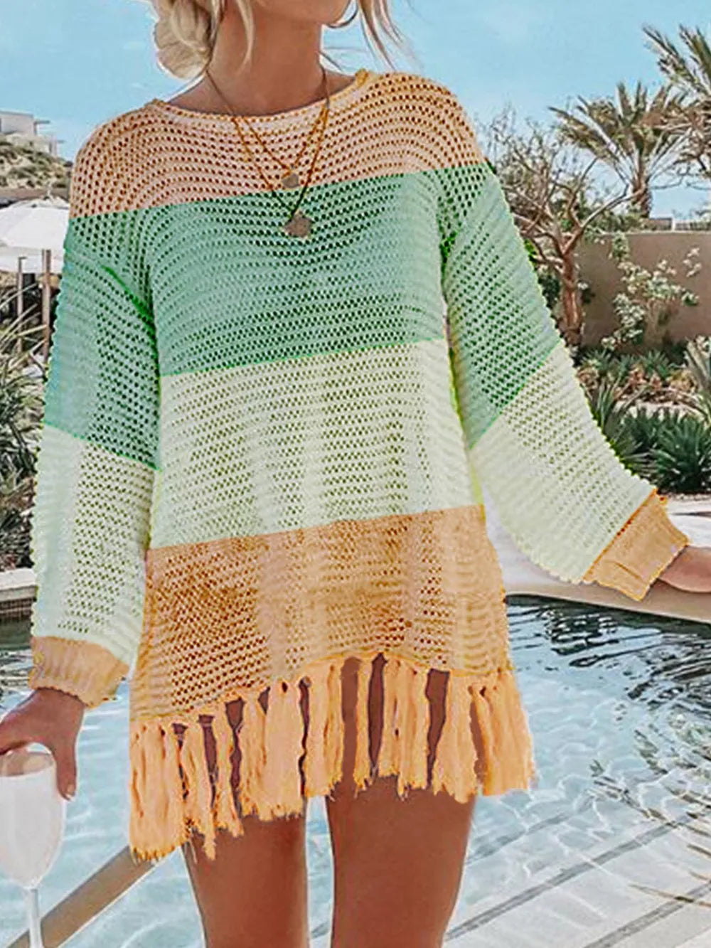 Light green and cream colorblock knit cover up with tassel fringe hem.