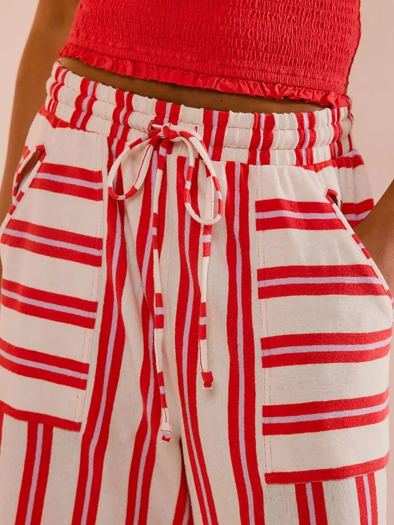 Red-and-white striped wide-leg drawstring pants with tie waist