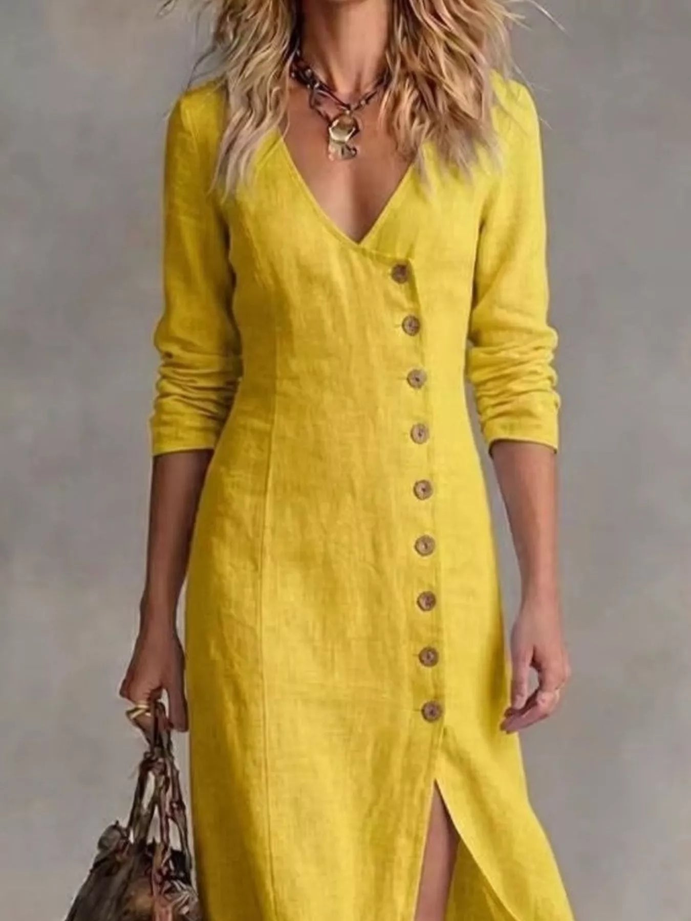 Yellow maxi dress close-up: V-neck and row of buttons on the front